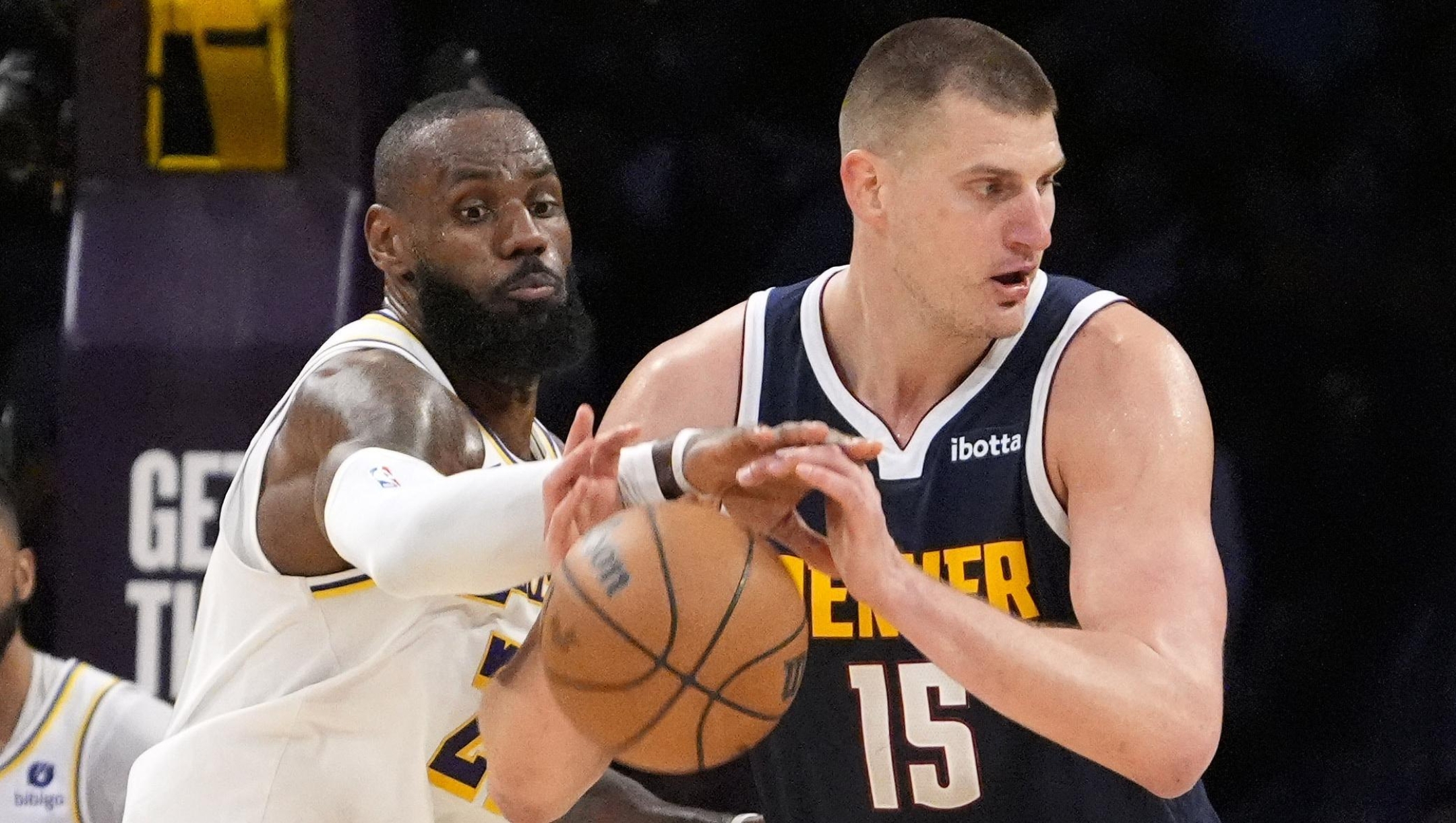 Los Angeles Lakers forward LeBron James, left, knocks the ball from the hands of Denver Nuggets center Nikola Jokic during the second half in Game 4 of an NBA basketball first-round playoff series Saturday, April 27, 2024, in Los Angeles. (AP Photo/Mark J. Terrill)