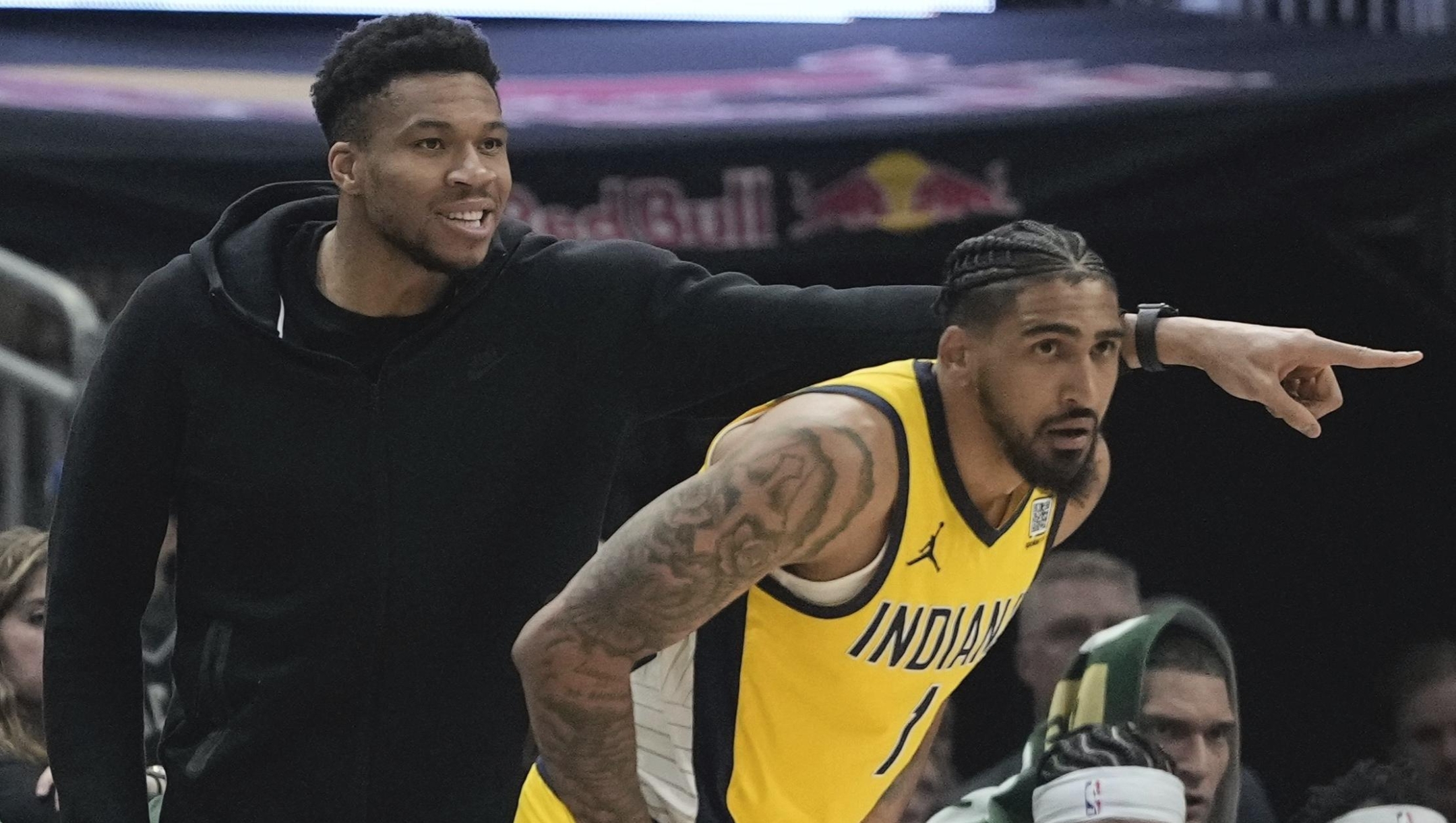 Milwaukee Bucks' Giannis Antetokounmpo reacts from the bench in front of Indiana Pacers' Obi Toppin during the first half of Game 1 of the NBA playoff basketball game Sunday, April 21, 2024, in Milwaukee. (AP Photo/Morry Gash)