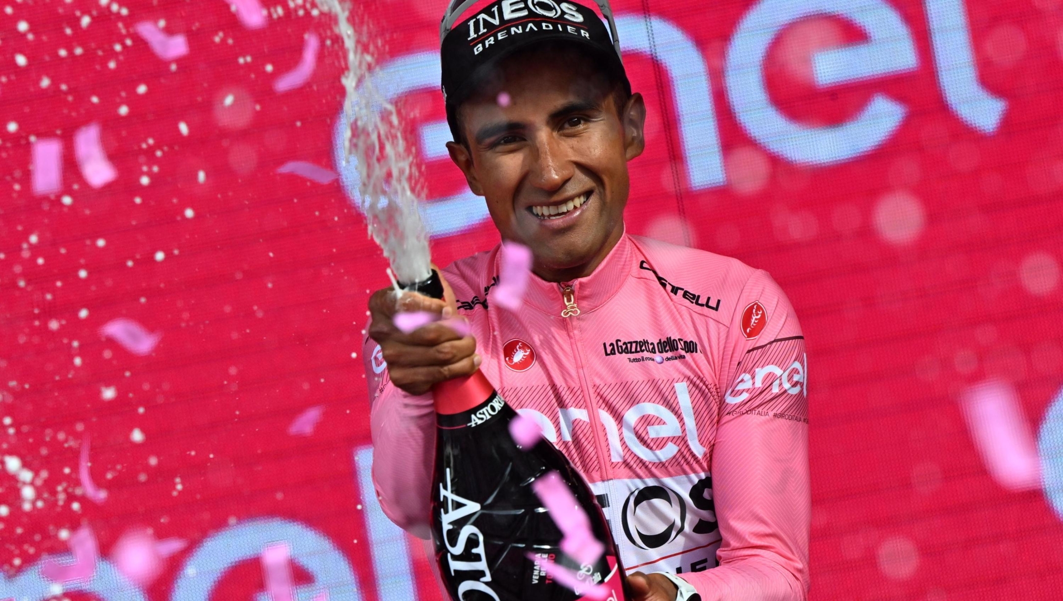 Equadorian rider Jhonatan Manuel Narvaez Prado of team Ineos Grenadiers team wearing the overall leader's pink jersey celebrates on the podium  after  the 1th stage of the 107 Giro d'Italia 2024, cycling race over 140 km from Venaria Reale to Torino, Italy, 04 May 2024. ANSA/LUCA