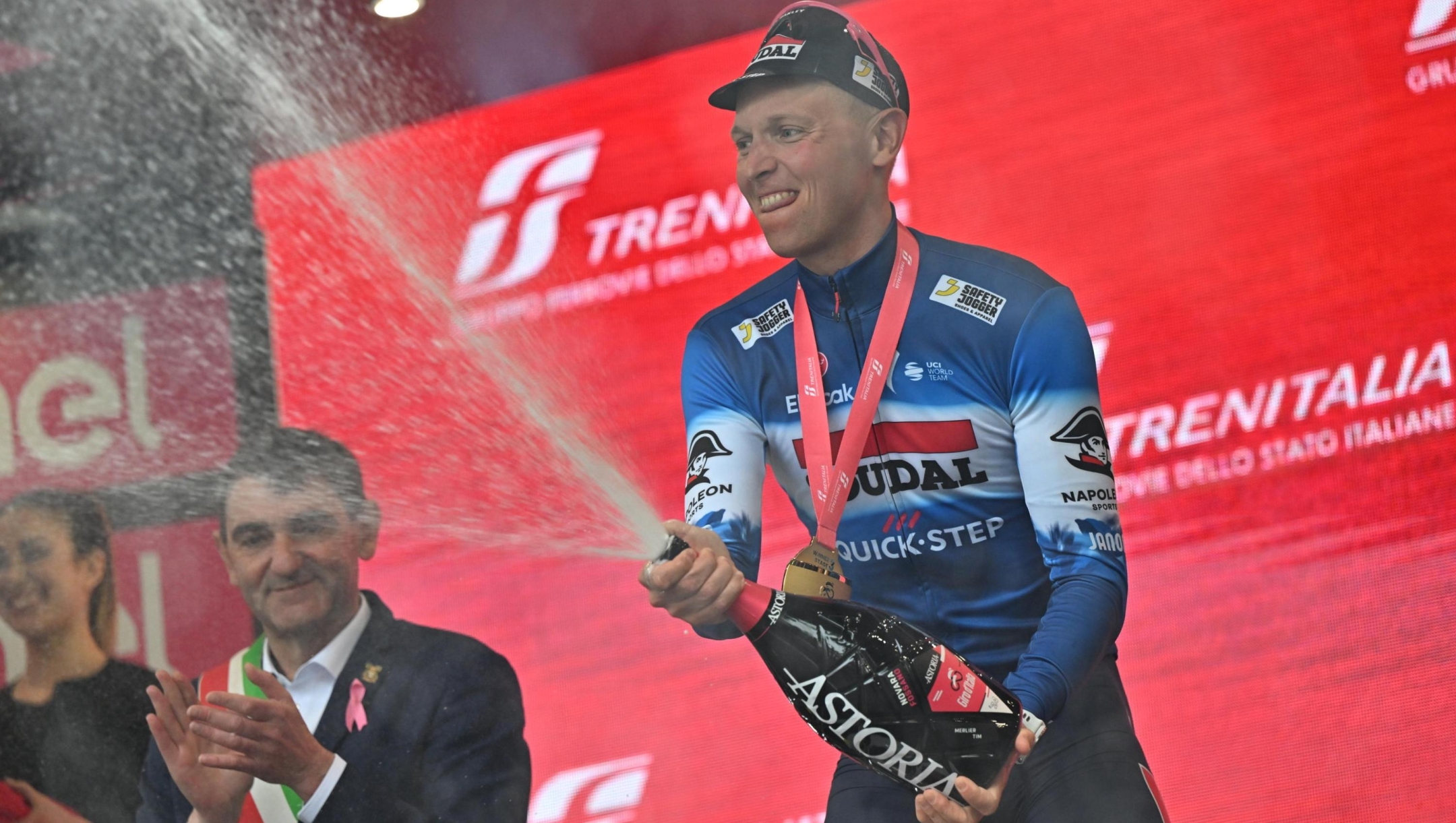 Belgian rider Tim Merlier of Soudal Quick-Step team celebrates on the podium after winning the 3th stage of the 107 Giro d'Italia 2024, cycling race over 166 km from Novara to Fossano, Italy, 06 May 2024. ANSA/LUCA ZENNARO