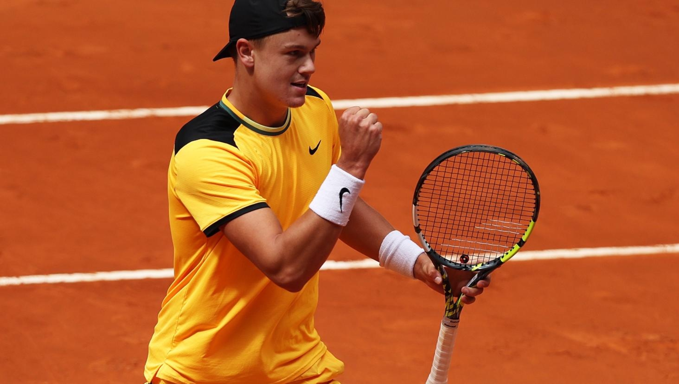 MADRID, SPAIN - APRIL 28:  Holger Rune of Denmark celebrates a point against Tallon Griekspoor of Netherlands in the Men's Singles Round of 32 match during Day Six of the Mutua Madrid Open at La Caja Magica on April 28, 2024 in Madrid, Spain. (Photo by Clive Brunskill/Getty Images)