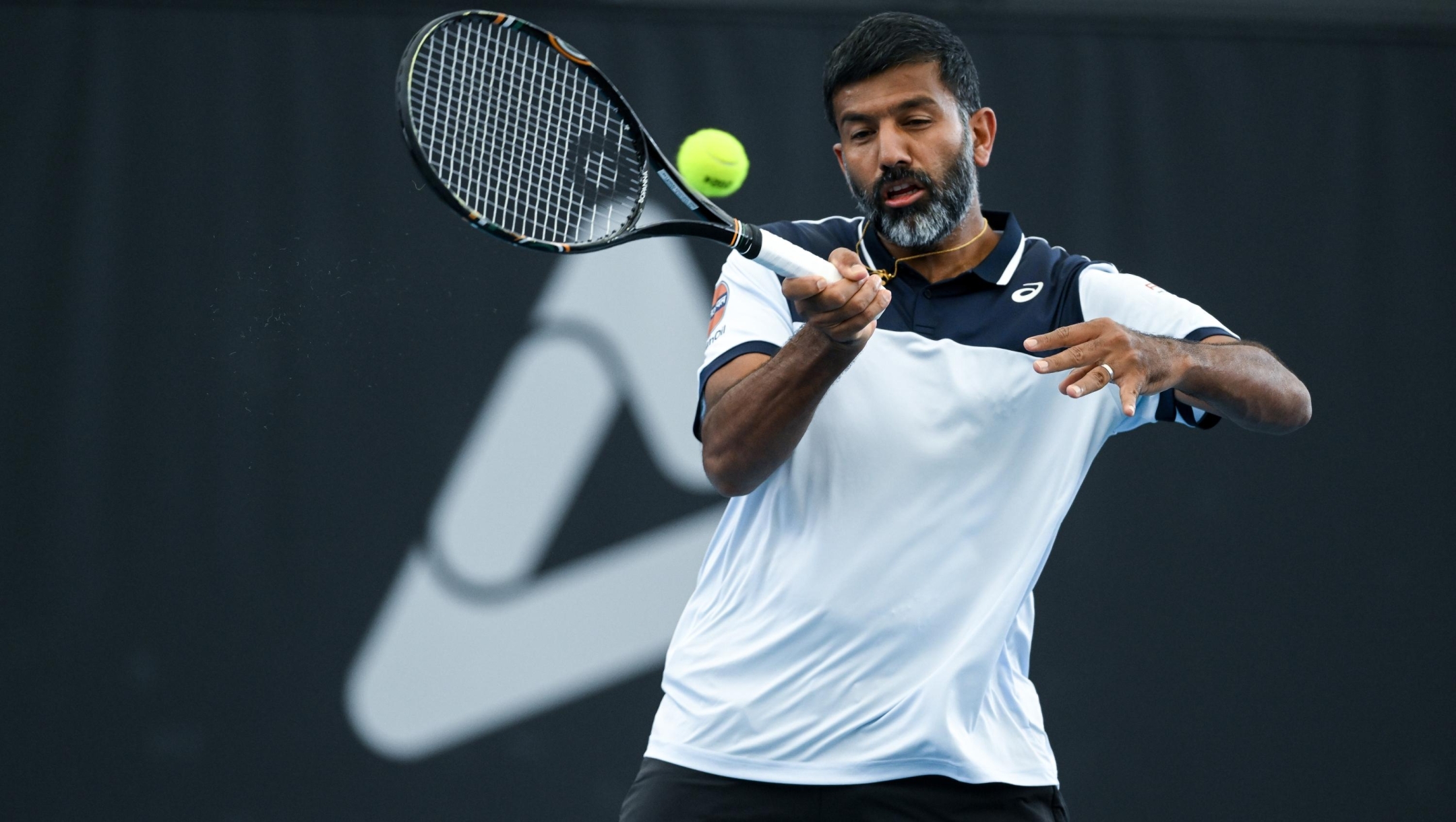 ADELAIDE, AUSTRALIA - JANUARY 13:  Rohan Bopanna of India plays a forehand during their match against   Rajeev Ram of the USA and Joe Salisbury of Great Britain in the 2024 Adelaide International at Memorial Drive on January 13, 2024 in Adelaide, Australia. (Photo by Mark Brake/Getty Images)