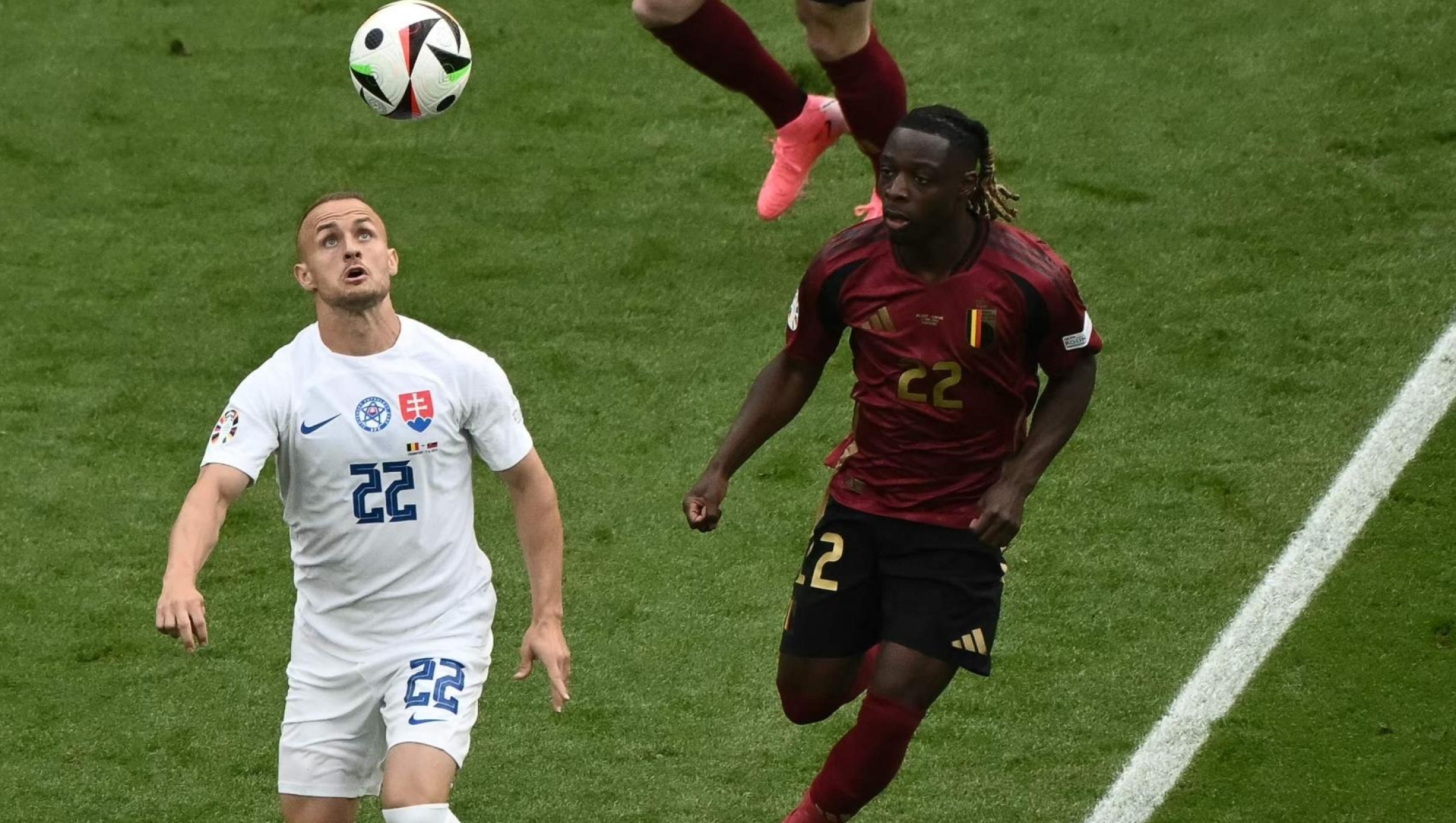 Slovakia's midfielder #22 Stanislav Lobotka is marked by Belgium's forward #22 Jeremy Doku during the UEFA Euro 2024 Group E football match between Belgium and Slovakia at the Frankfurt Arena in Frankfurt am Main on June 17, 2024. (Photo by Angelos Tzortzinis / AFP)