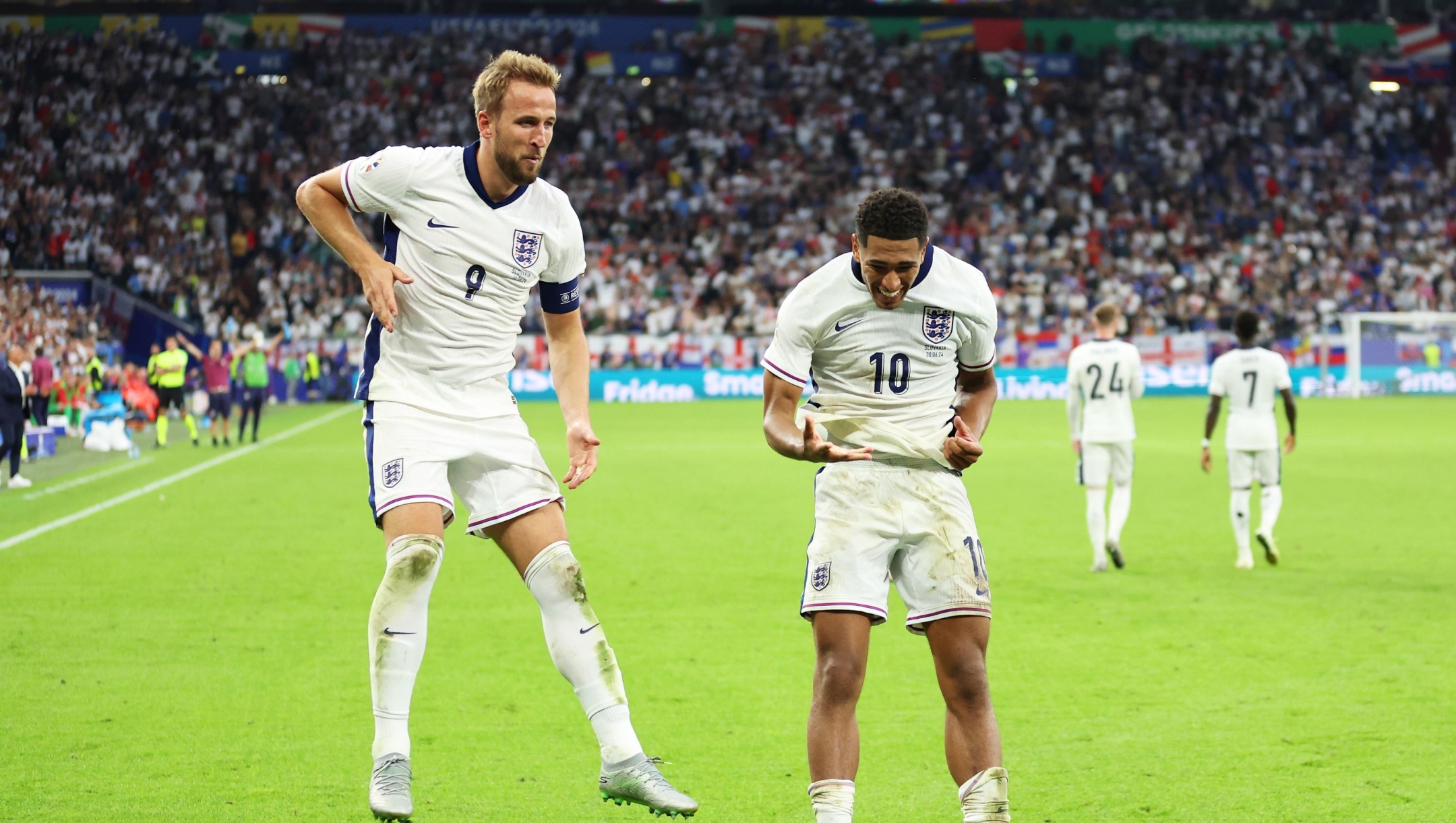 GELSENKIRCHEN, GERMANY - JUNE 30: Harry Kane of England celebrates scoring his team's second goal with teammate Jude Bellingham during the UEFA EURO 2024 round of 16 match between England and Slovakia at Arena AufSchalke on June 30, 2024 in Gelsenkirchen, Germany. (Photo by Carl Recine/Getty Images)