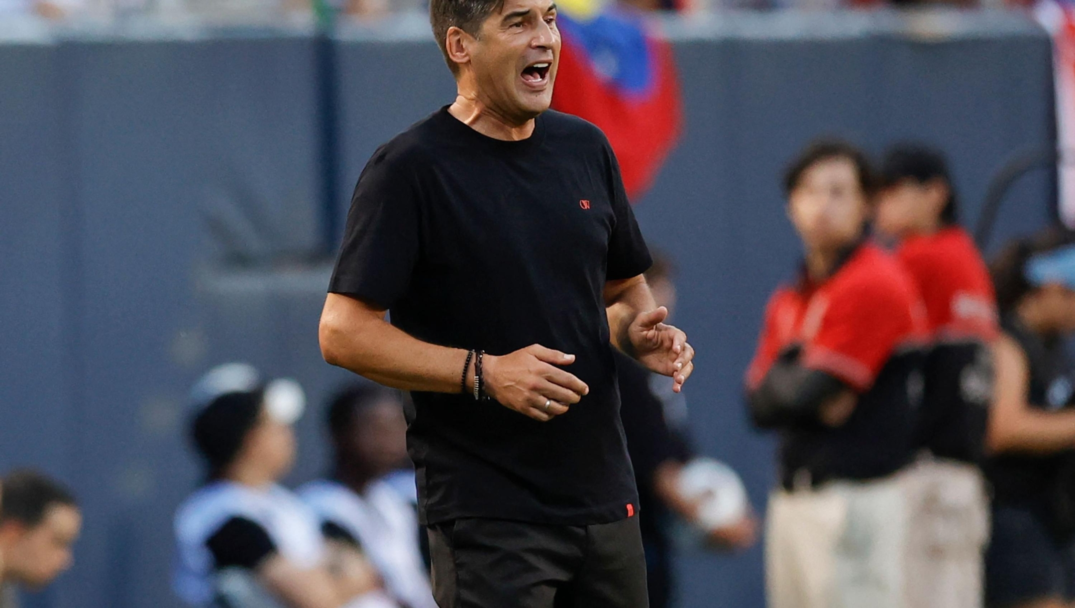 AC Milan's manager Paulo Fonseca yells to his team during the first half of the pre-season club friendly football match between AC Milan and Real Madrid at Soldier Field in Chicago, Illinois, on July 31, 2024. (Photo by KAMIL KRZACZYNSKI / AFP)