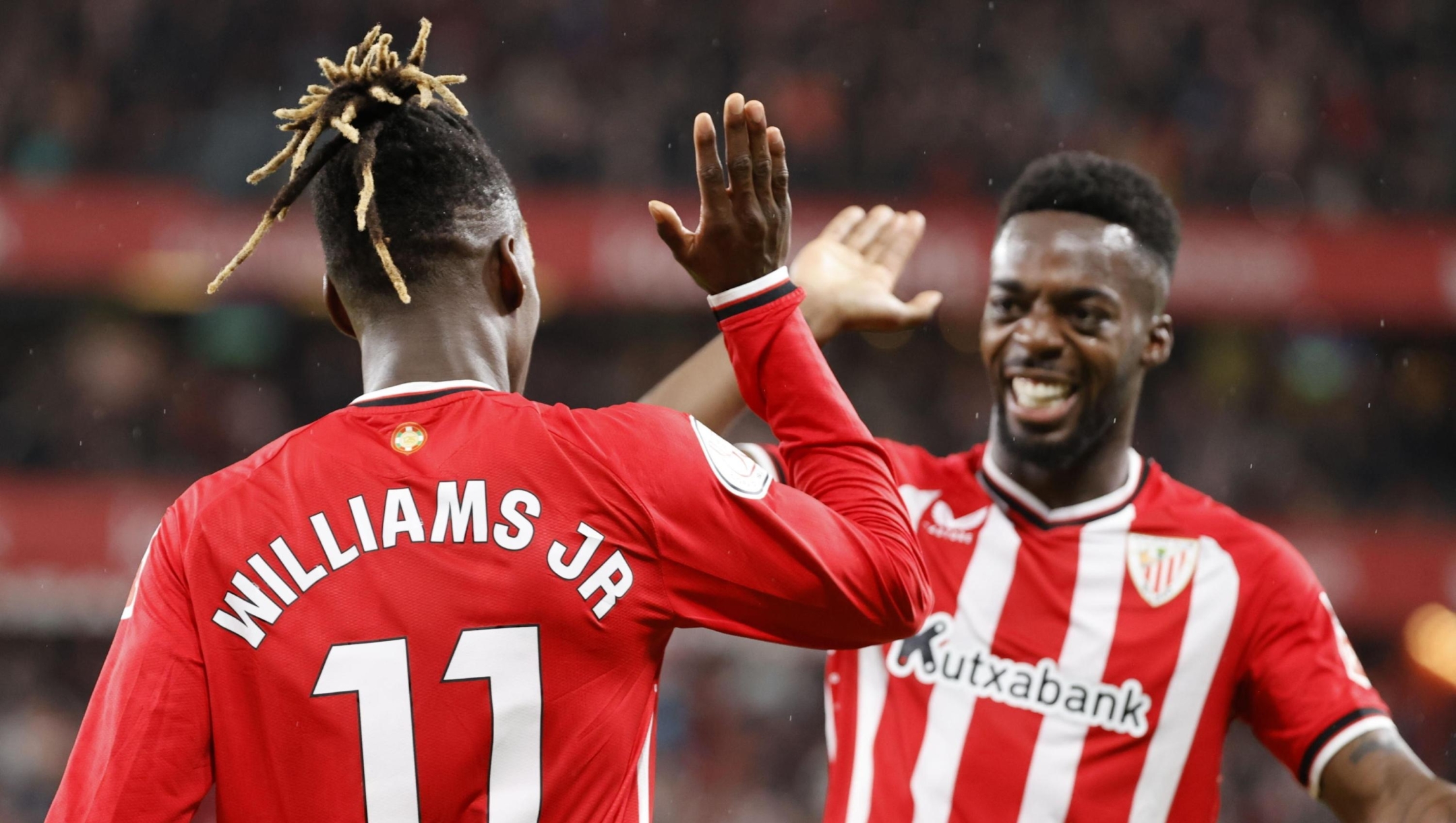 epaselect epa11189629 Athletic's Nico Williams celebrates with his brother and teammate Inaki Williams (R) after scoring the 2-0 goal during the Spanish King's Cup semifinal second leg soccer match between Athletic Club Bilbao and Atletico Madrid, in Bilbao, Spain, 29 February 2024.  EPA/LUIS TEJIDO