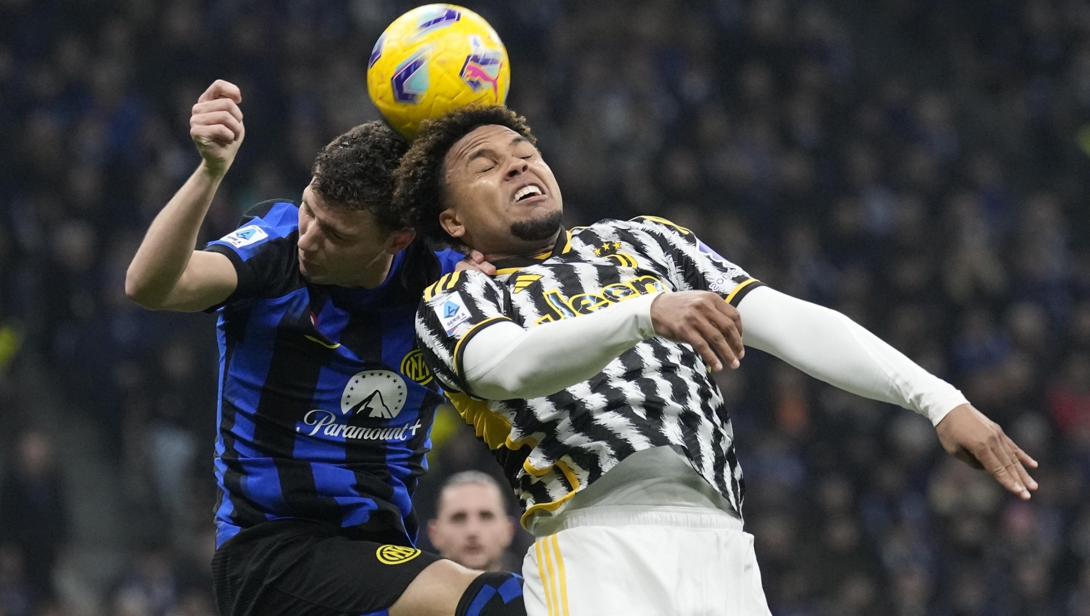 Inter Milan's Benjamin Pavard, left, and Juventus' Weston McKennie jump for the ball during a Serie A soccer match between Inter Milan and Juventus, in Milan, Italy, Sunday, Feb. 4, 2024. (AP Photo/Antonio Calanni)