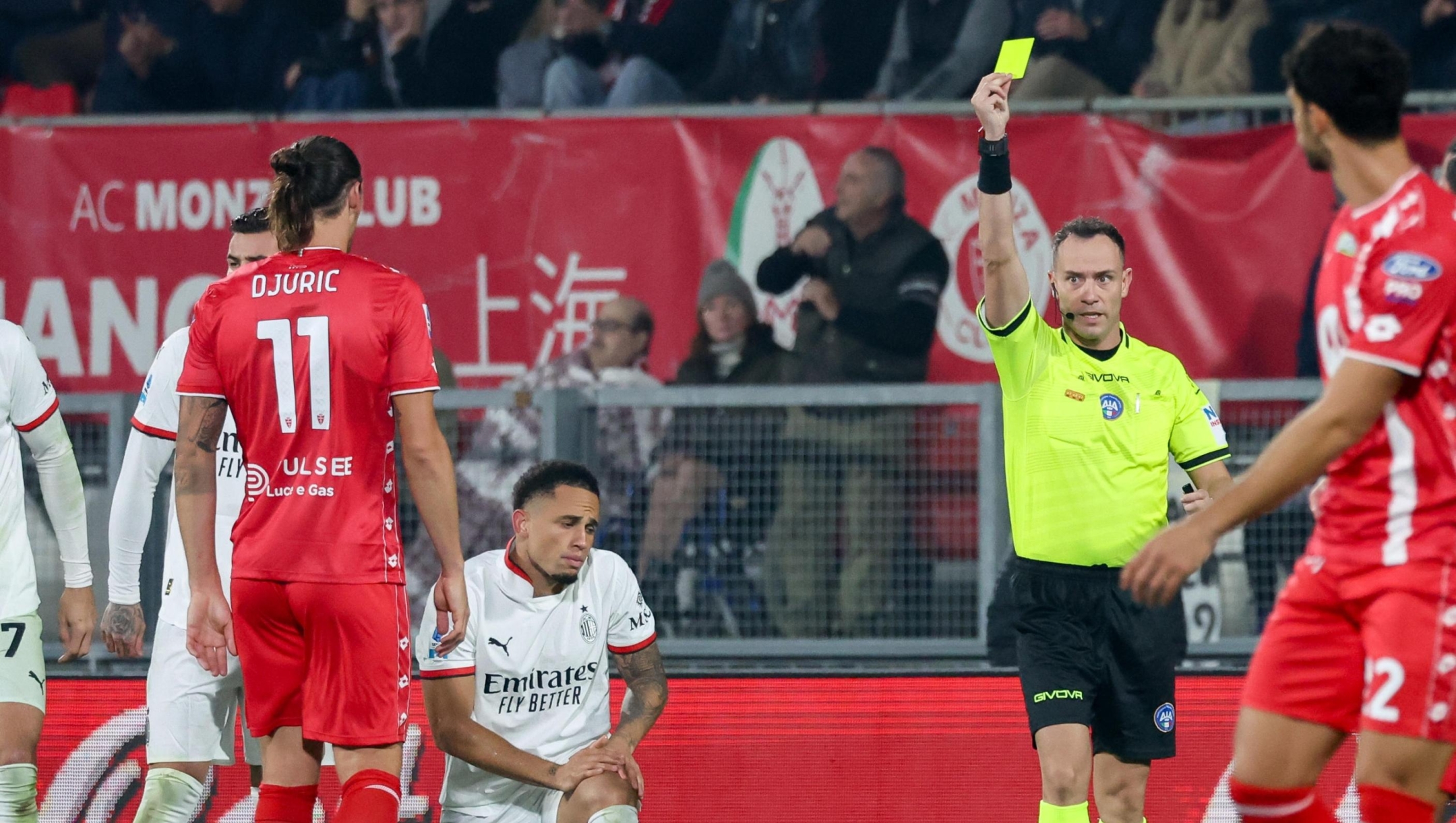 referee Ermanno Feliciani shows the yellow card to AC Monza's forward Milan Djuric during the Italian Serie A soccer match between AC Monza and AC Milan at U-Power Stadium in Monza, Italy, 02 November 2024. ANSA / ROBERTO BREGANI