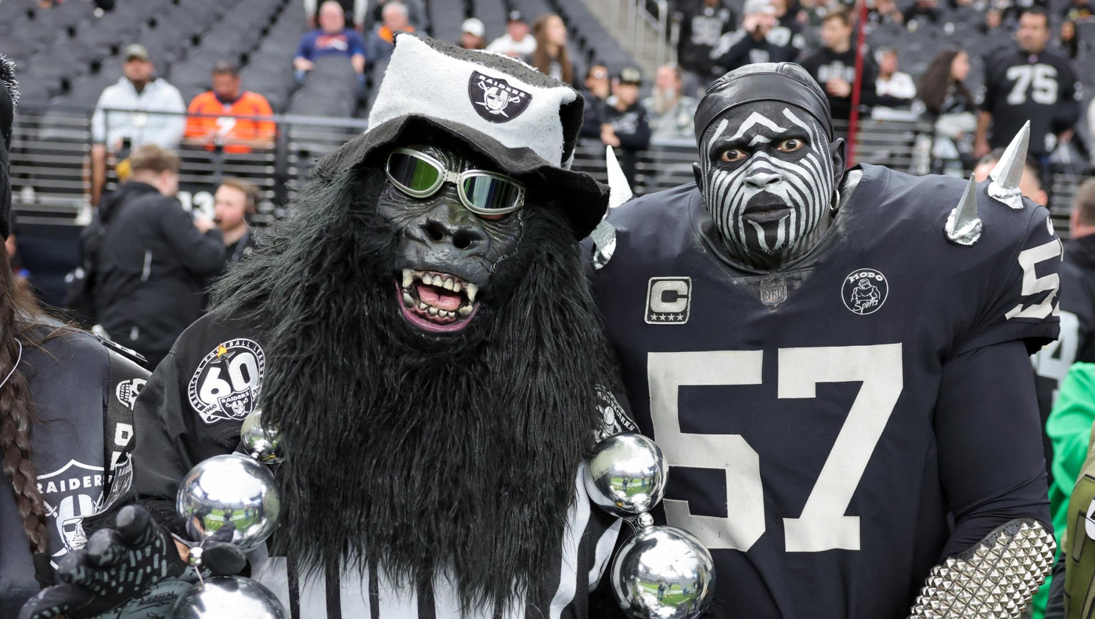 LAS VEGAS, NEVADA - JANUARY 07: Las Vegas Raiders fans Mark "Gorilla Rilla" Acasio (L) and Pro Football Hall of Fame member Wayne "The Violator" Mabry pose for photos before the Raiders' game against the Denver Broncos at Allegiant Stadium on January 07, 2024 in Las Vegas, Nevada. The Raiders defeated the Broncos 27-14.   Ethan Miller/Getty Images/AFP (Photo by Ethan Miller / GETTY IMAGES NORTH AMERICA / Getty Images via AFP)