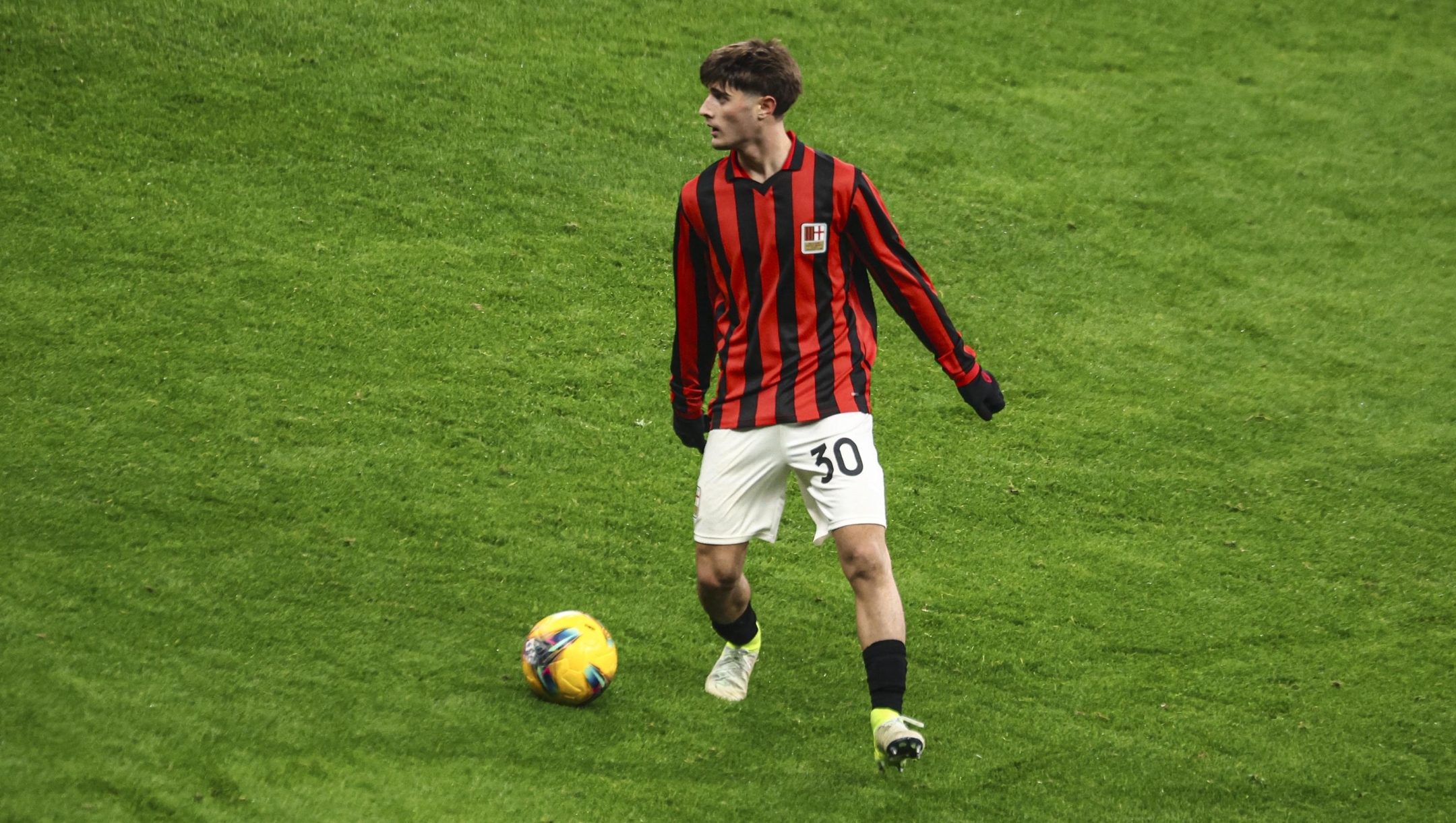 MILAN, ITALY - DECEMBER 15: Mattia Liberali of AC Milan in action during the Serie A match between AC Milan and Genoa at Stadio Giuseppe Meazza on December 15, 2024 in Milan, Italy. (Photo by Giuseppe Cottini/AC Milan via Getty Images)