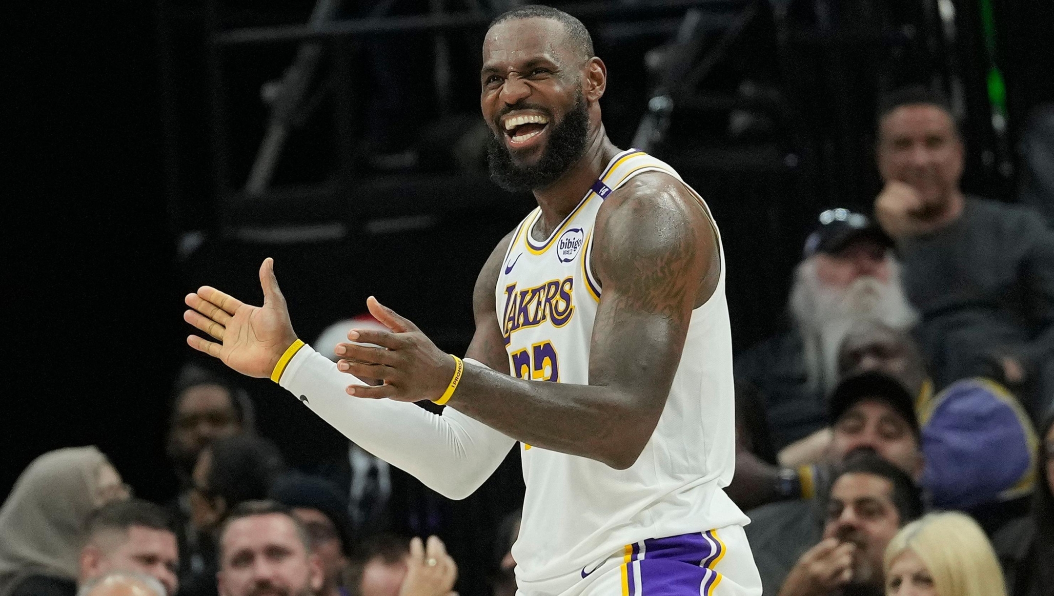 SACRAMENTO, CALIFORNIA - DECEMBER 21: LeBron James #23 of the Los Angeles Lakers reacts after Cam Reddish #5 makes a basket and gets fouled on the shot against the Sacramento Kings during the second half at Golden 1 Center on December 21, 2024 in Sacramento, California. NOTE TO USER: User expressly acknowledges and agrees that, by downloading and or using this photograph, User is consenting to the terms and conditions of the Getty Images License Agreement.   Thearon W. Henderson/Getty Images/AFP (Photo by Thearon W. Henderson / GETTY IMAGES NORTH AMERICA / Getty Images via AFP)