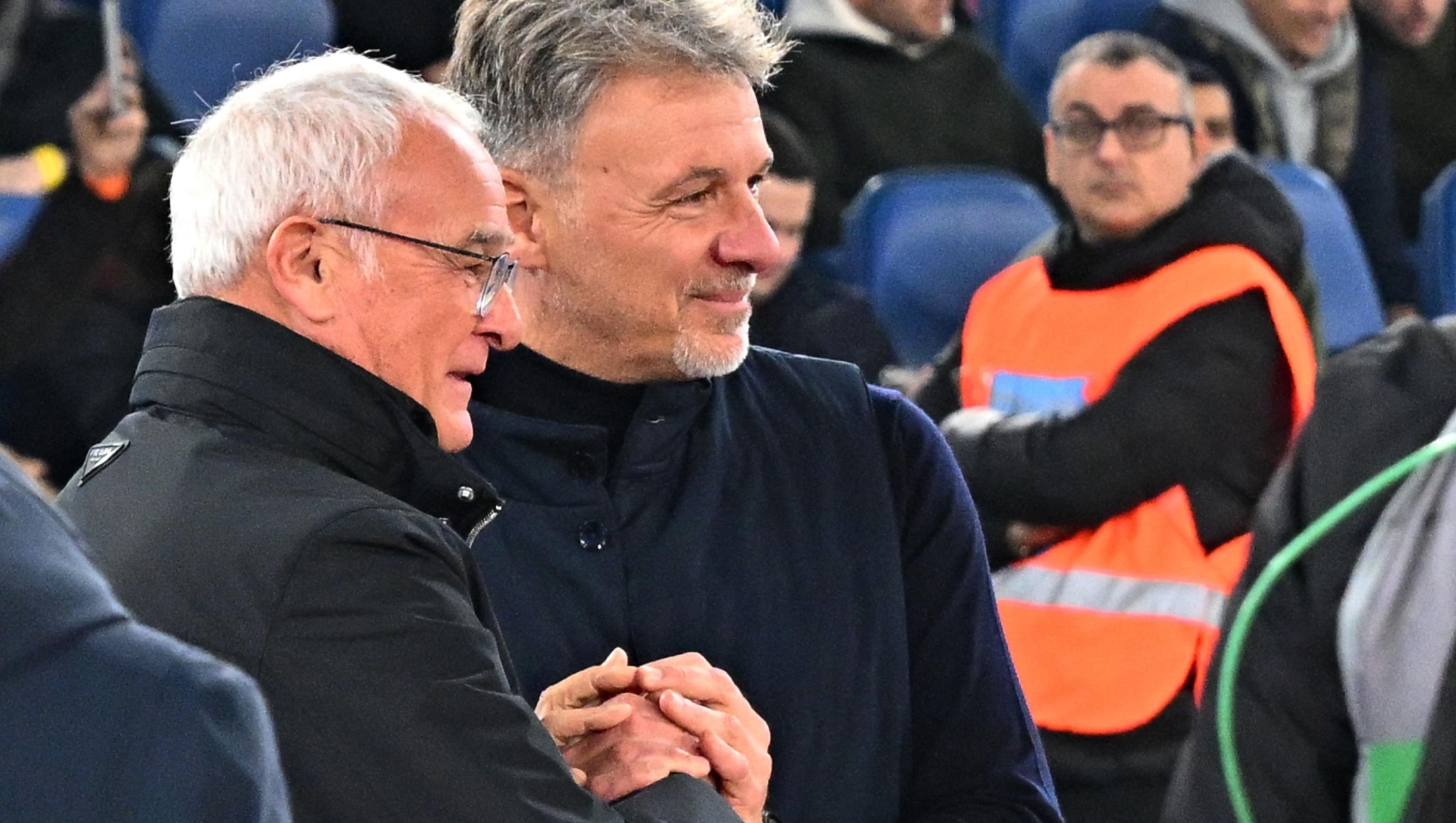 Roma's Italian head coach Claudio Ranieri (L) shakes hands with Lazio's Italian head coach Marco Baroni before the Italian Serie A football match between Roma and Lazio, at the Olympic stadium in Rome on January 5, 2025. (Photo by Andreas SOLARO / AFP)