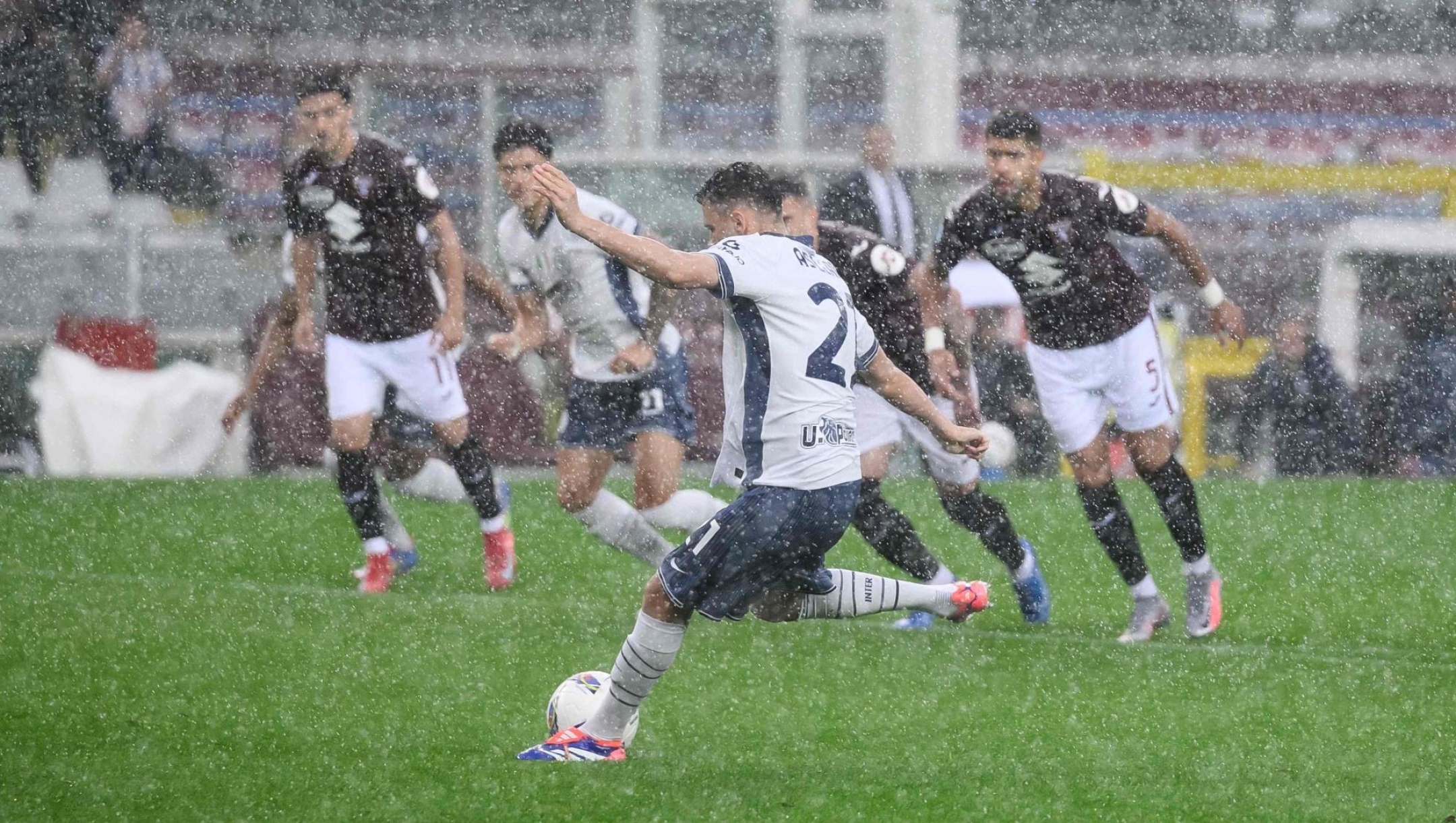 Inter Milan's Albanian midfielder #21 Kristjan Asllani kicks the ball and scores a goal during the Italian Serie A football match between Torino and Inter Milan, at Torino's Olympic Stadium, in Turin on May 11, 2025. (Photo by NICOLO CAMPO / AFP)