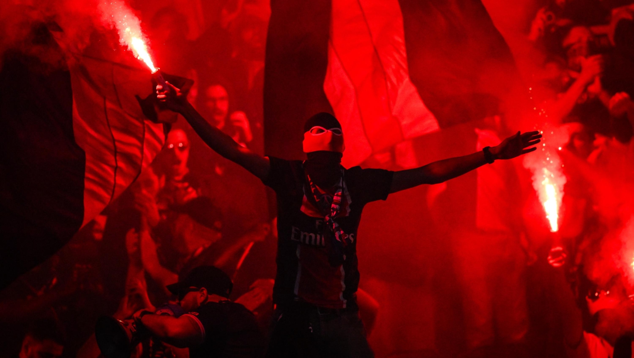 Supporters of PSG using smoke bombs during the UEFA Champions League, Semi-finals, 2nd leg football match between Paris Saint-Germain and Arsenal FC on 7 May 2025 at Parc des Princes stadium in Paris, France - Photo Matthieu Mirville / DPPI (Photo by Matthieu Mirville / Matthieu Mirville / DPPI via AFP)