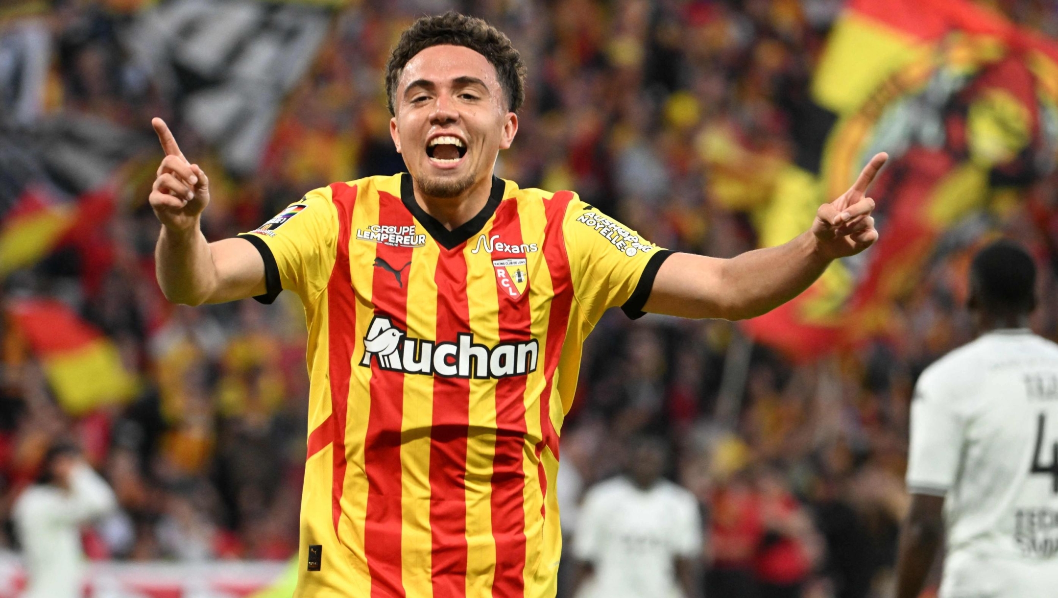 Lens' midfielder #23 Neil El Aynaoui celebrates after scoring a goal during the French L1 football match between RC Lens and AS Monaco at Stade Bollaert-Delelis in Lens, northern France on May 17, 2025. (Photo by FRANCOIS NASCIMBENI / AFP)