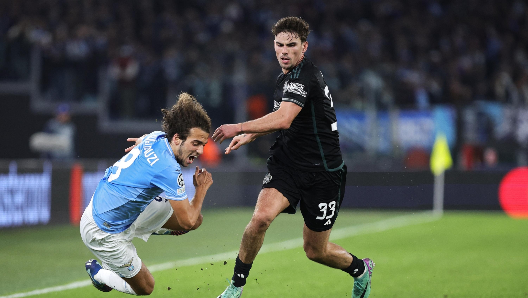 Matteo Guendouzi of Lazio (L) vies for the ball with Matthew O'Riley of Celtic during the UEFA Champions League, Group E football match between SS Lazio and Celtic FC on November 28, 2023 at Stadio Olimpico in Rome, Italy - Photo Federico Proietti / DPPI (Photo by Federico Proietti / DPPI via AFP)
