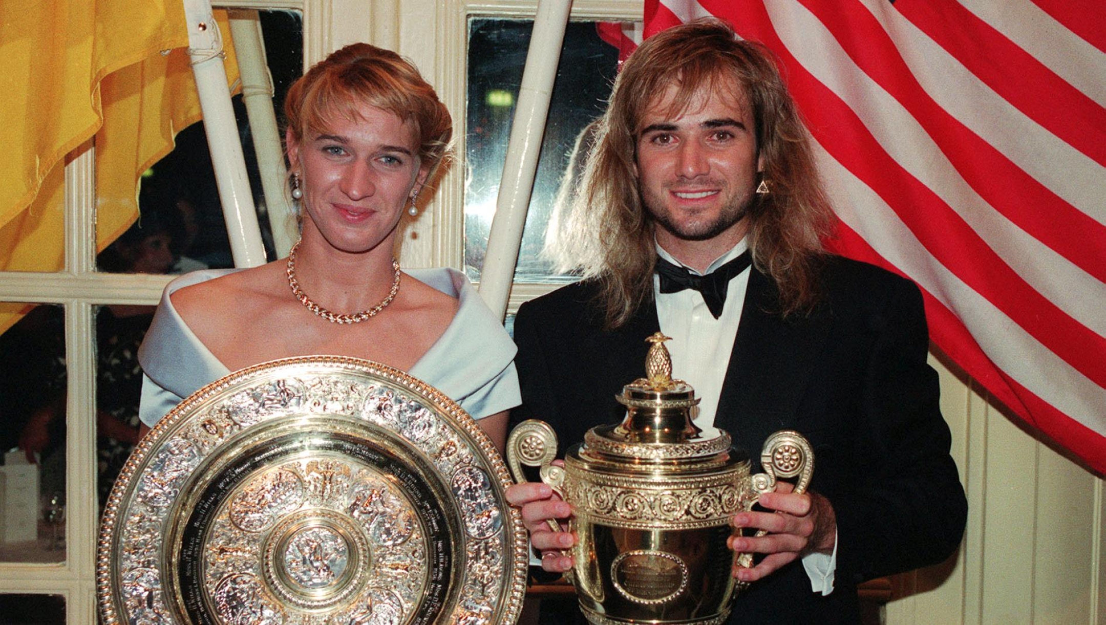 Wimbledon Champions Steffi Graf and Andre Agassi with their trophies at the Savoy Hotel in London for the post Wimbledon dinner.   (Photo by David Giles - PA Images/PA Images via Getty Images)