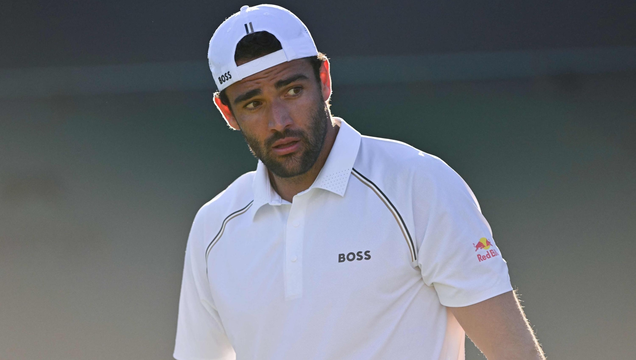 Italy's Matteo Berrettini reacts as he plays against Poland's Kamil Majchrzak during their men's singles first round tennis match on the first day of the 2025 Wimbledon Championships at The All England Lawn Tennis and Croquet Club in Wimbledon, southwest London, on June 30, 2025. (Photo by Glyn KIRK / AFP) / RESTRICTED TO EDITORIAL USE