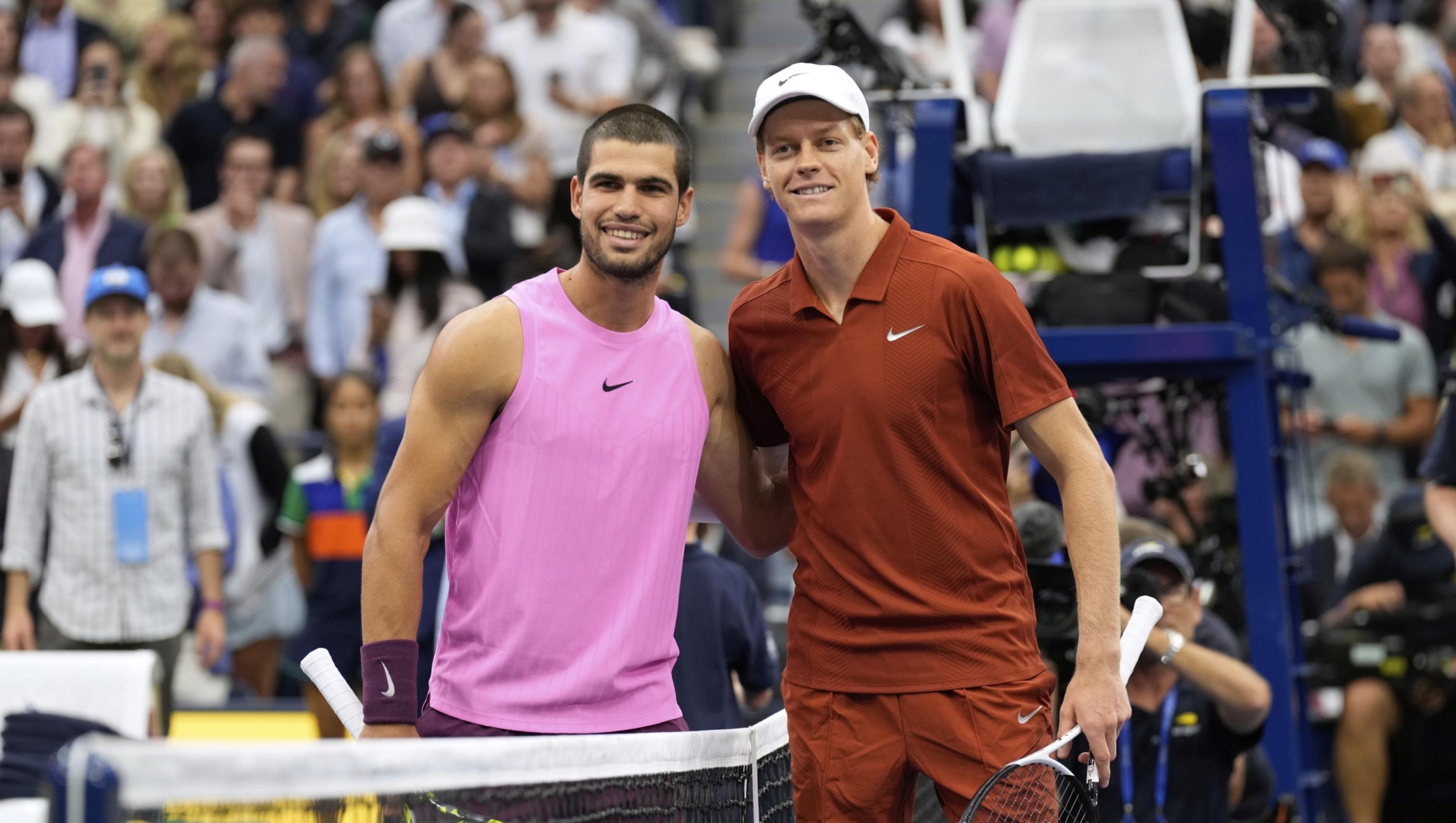 Carlos Alcaraz, of Spain, left, and Jannik Sinner, of Italy, right, prepare to face off in the men's singles final of the U.S. Open tennis championships, Sunday, Sept. 7, 2025, in New York. (AP Photo/Seth Wenig)