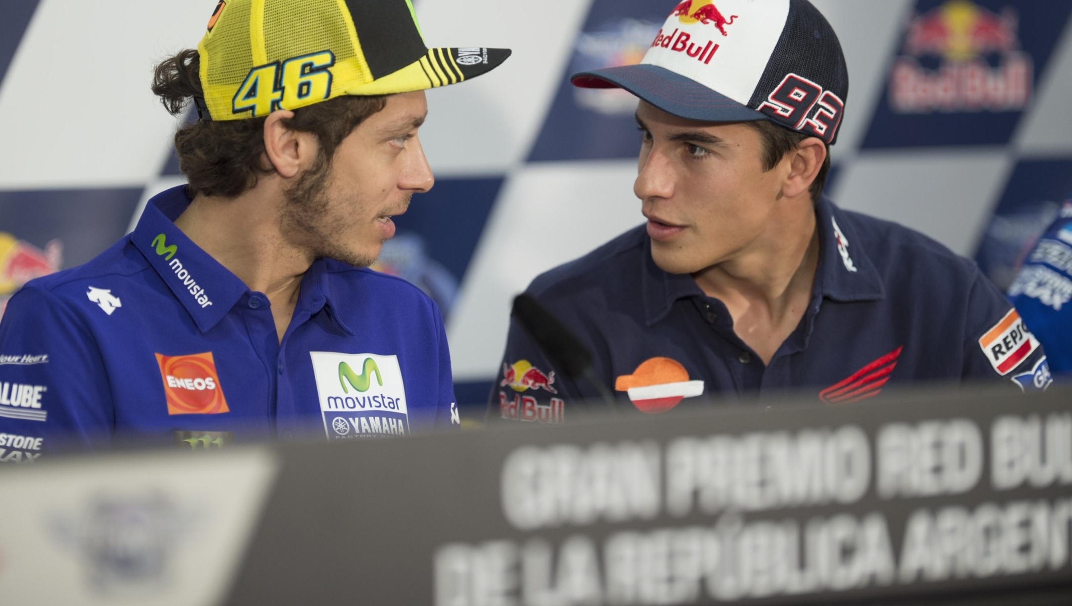   Marc Marquez of Spain and Repsol Honda Team speaks with Valentino Rossi of Italy and Movistar Yamaha MotoGP (L)  during the press conference pre-event during the MotoGp of Argentina Previews  at  on April 16, 2015 in Rio Hondo, Argentina.  (Photo by Mirco Lazzari gp/Getty Images)