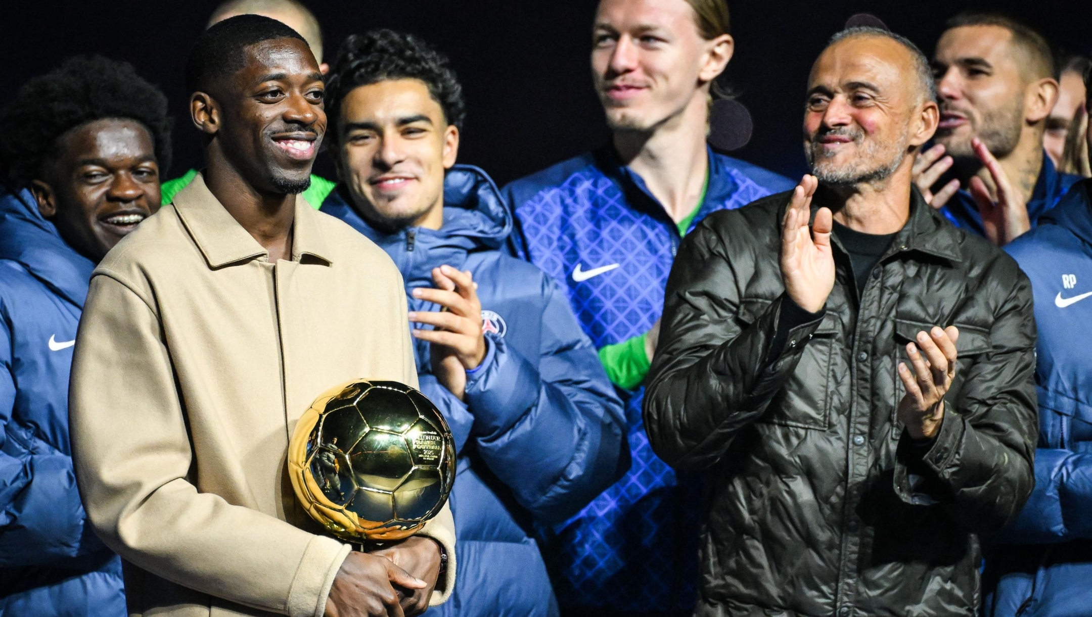 Ousmane DEMBELE of PSG celebrates with the Ballon d'Or trophy and Luis ENRIQUE of PSG during the French championship Ligue 1 football match between Paris Saint-Germain and AJ Auxerre on 27 September 2025 at Parc des Princes stadium in Paris, France - Photo Matthieu Mirville / DPPI (Photo by Matthieu Mirville / DPPI via AFP)