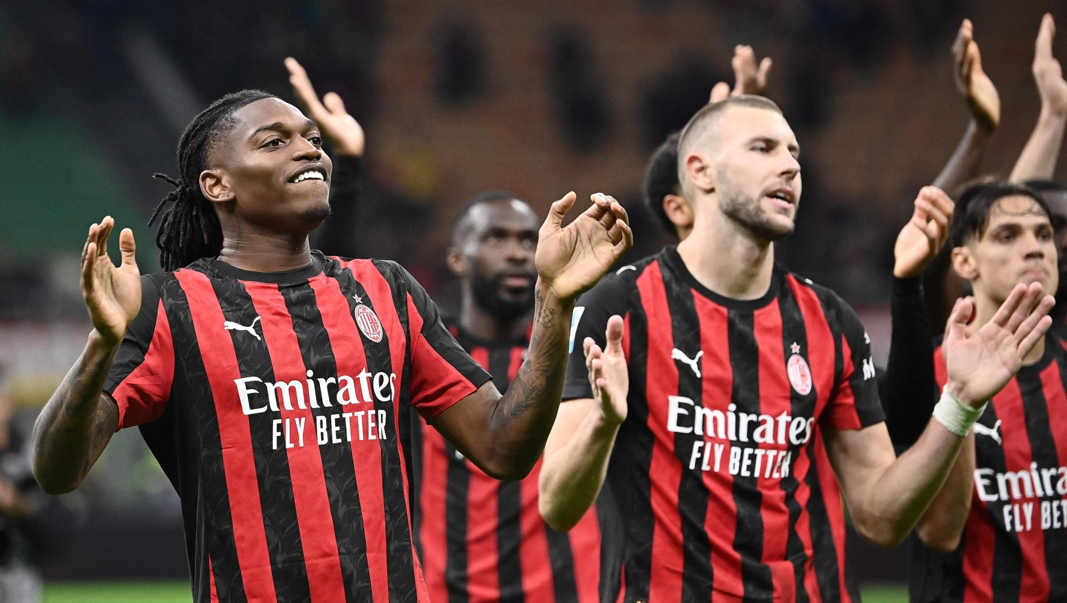 AC Milan's Portuguese forward #10 Rafael Leao (L) and AC Milan's Serbian defender #31 Strahinja Pavlovic celebrate at the end of the Italian Serie A football match between AC Milan and AS Roma at San Siro stadium in Milan, on November 2, 2025. (Photo by Isabella BONOTTO / AFP)