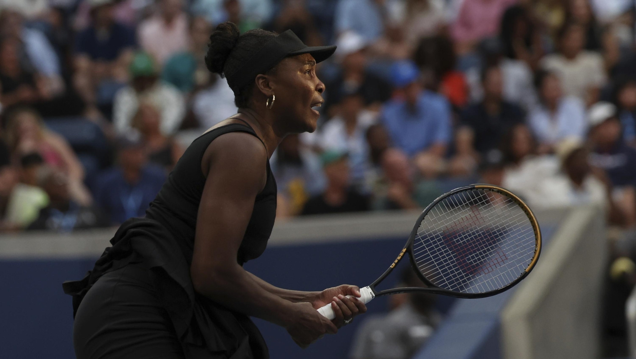 Venus Williams, of the United States, returns a shot with partner Leylah Fernandez, of Canada, during a quarterfinal doubles match at the U.S. Open tennis championships, Tuesday, Sept. 2, 2025, in New York. (AP Photo/Heather Khalifa)