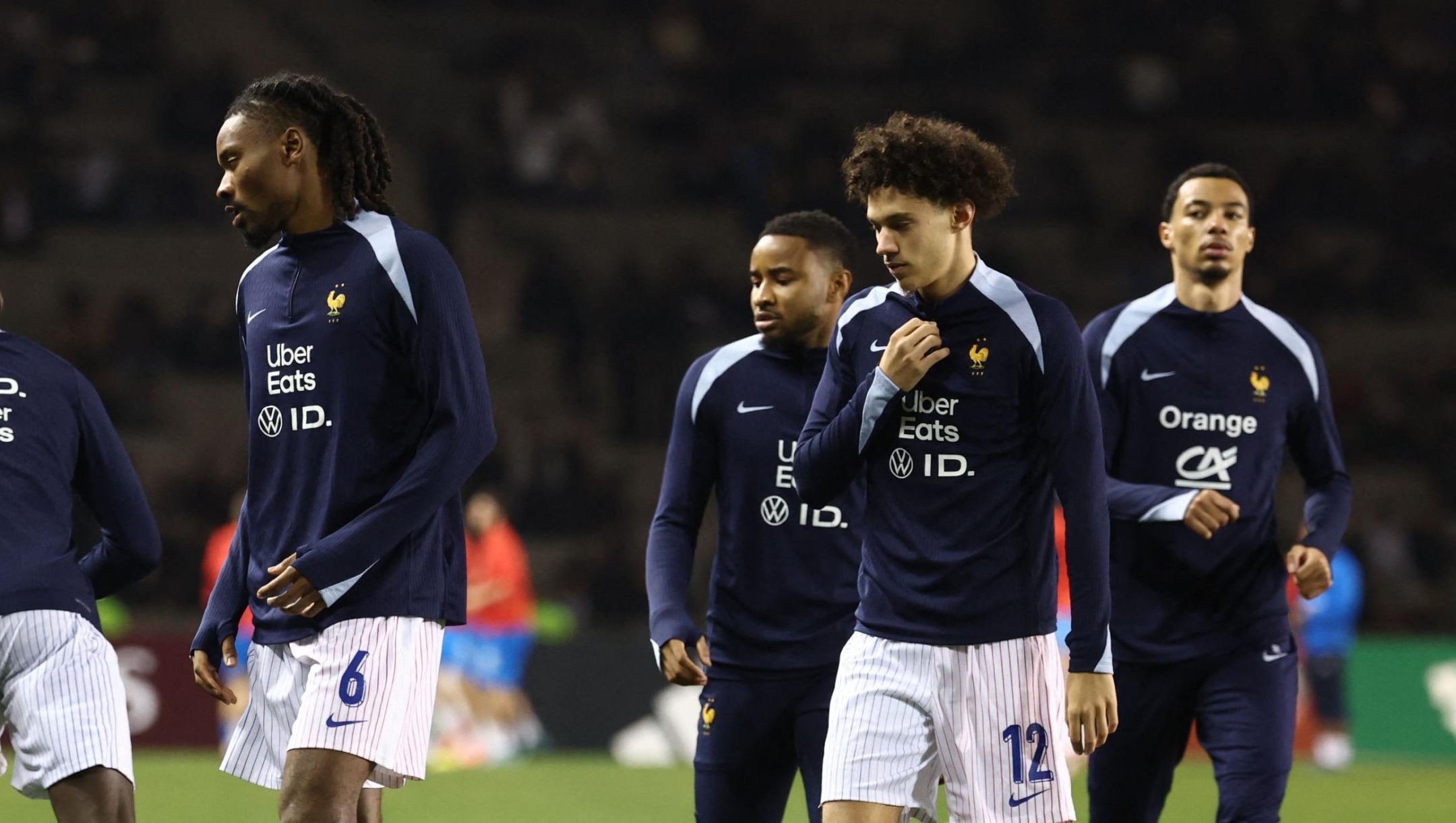 France's players, including midfielder #06 Khephren Thuram and forward #12 Maghnes Akliouche, warm up prior to the FIFA World Cup 2026 European qualification football match between Azerbaijan and France at the Tofiq Bahramov Republican Stadium in Baku on November 16, 2025. (Photo by FRANCK FIFE / AFP)