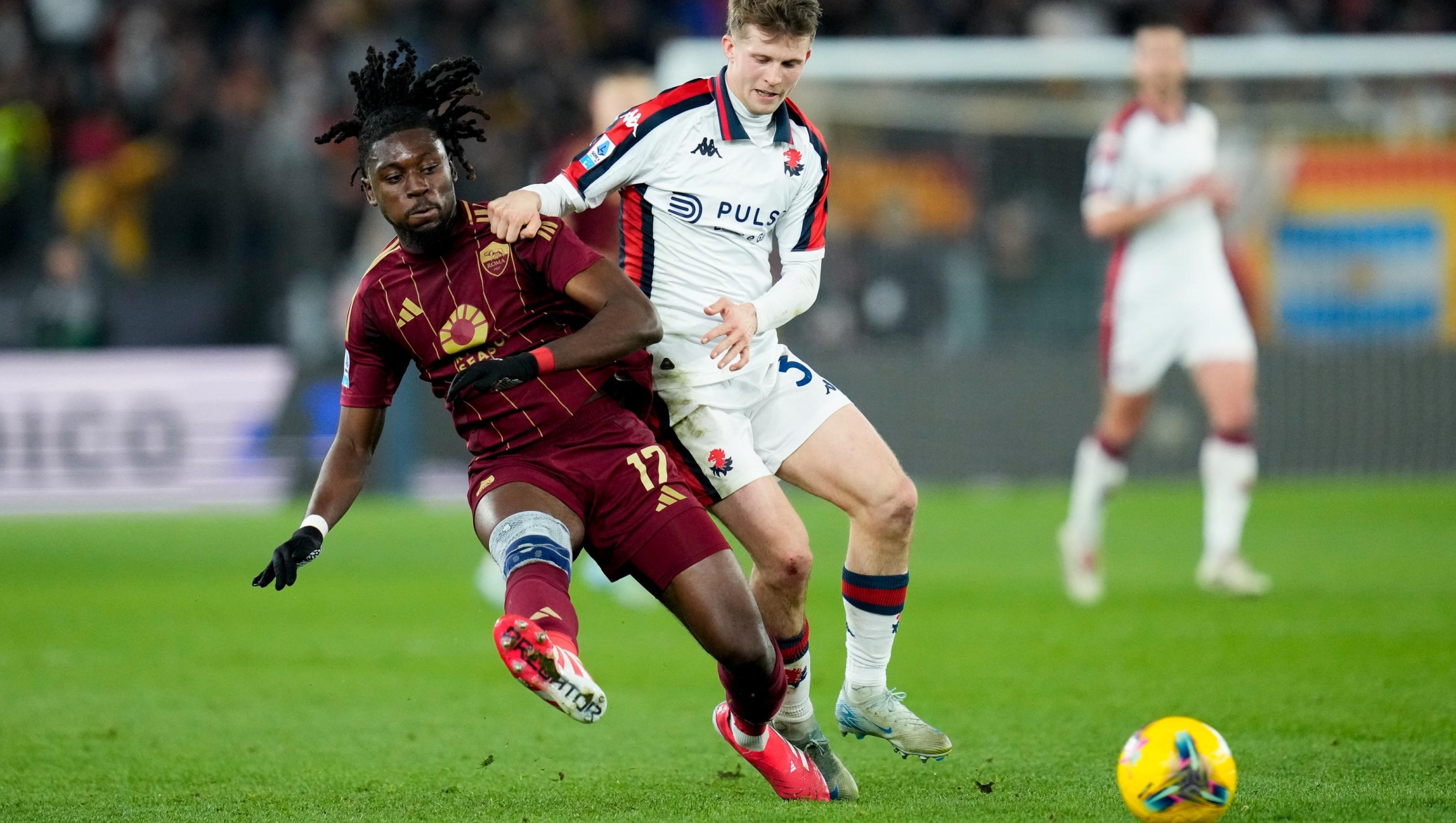 Morten Frendrup of Genoa CFC and Manu Kone' of AS Roma compete for the ball during the Serie A Enilive match between AS Roma and Genoa CFC at Stadio Olimpico on January 17, 2025 in Rome, Italy. (Photo by Giuseppe Maffia/NurPhoto) (Photo by Giuseppe Maffia / NurPhoto via AFP)