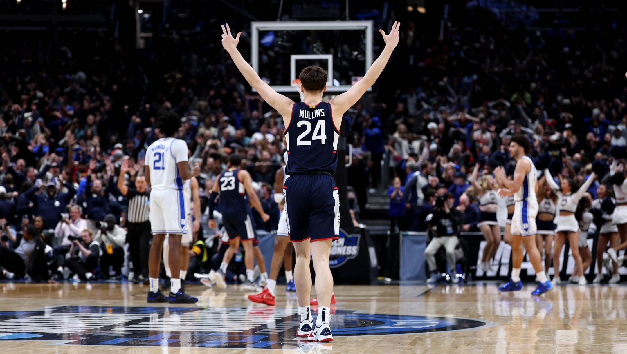  Braylon Mullins #24 of the UConn Huskies celebrates after shooting the game-winning three point basket during the second half of a game against the Duke Blue Devils in the Elite Eight of the 2026 NCAA Men's Basketball Tournament at Capital One Arena on March 29, 2026 in Washington, DC.   Emilee Chinn/Getty Images/AFP (Photo by Emilee Chinn / GETTY IMAGES NORTH AMERICA / Getty Images via AFP)