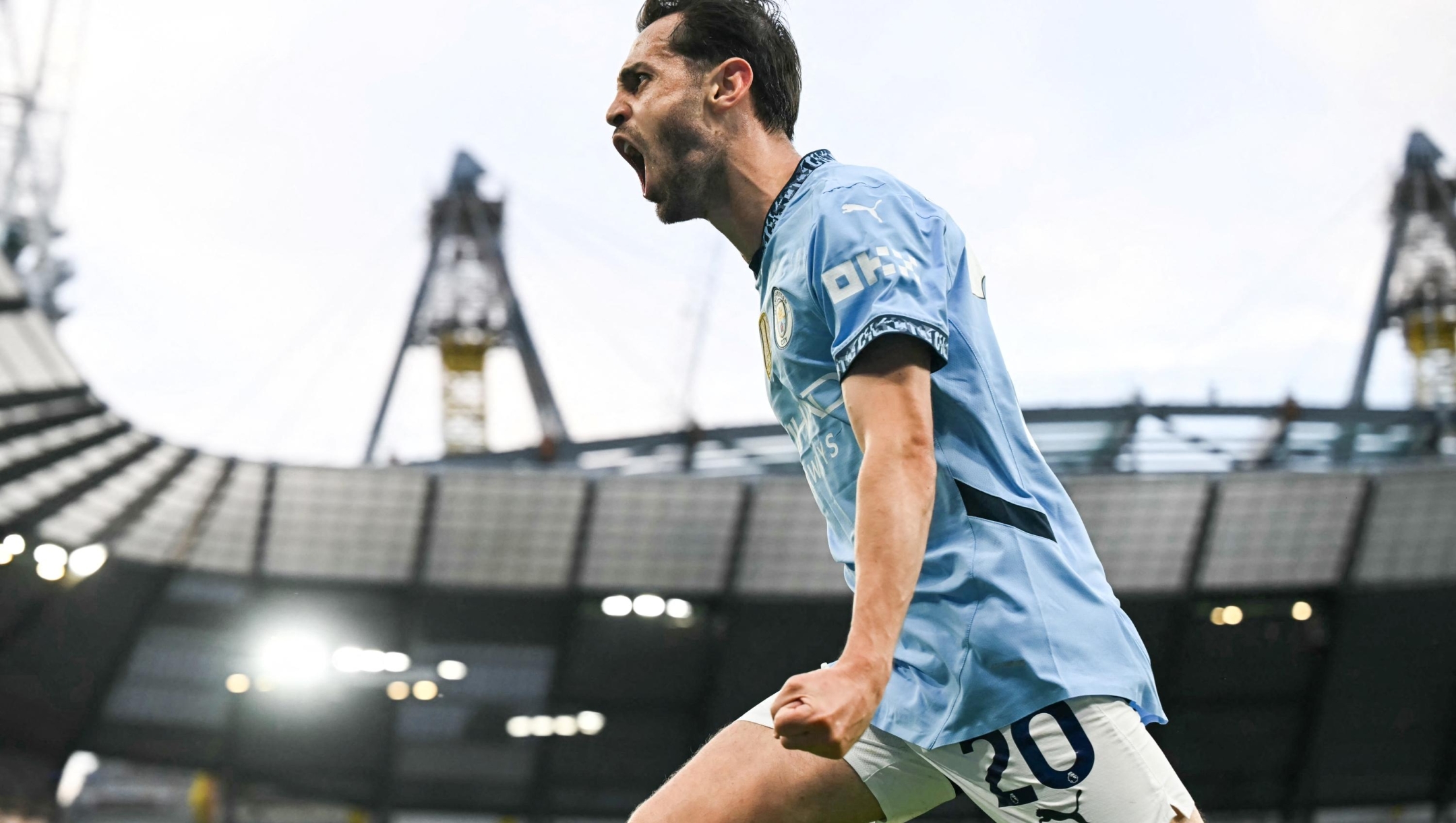 Manchester City's Portuguese midfielder #20 Bernardo Silva celebrates after scoring his team second goal during the English Premier League football match between Manchester City and Bournemouth at the Etihad Stadium in Manchester, north west England, on May 20, 2025. (Photo by Paul ELLIS / AFP) / RESTRICTED TO EDITORIAL USE. No use with unauthorized audio, video, data, fixture lists, club/league logos or 'live' services. Online in-match use limited to 120 images. An additional 40 images may be used in extra time. No video emulation. Social media in-match use limited to 120 images. An additional 40 images may be used in extra time. No use in betting publications, games or single club/league/player publications. /
