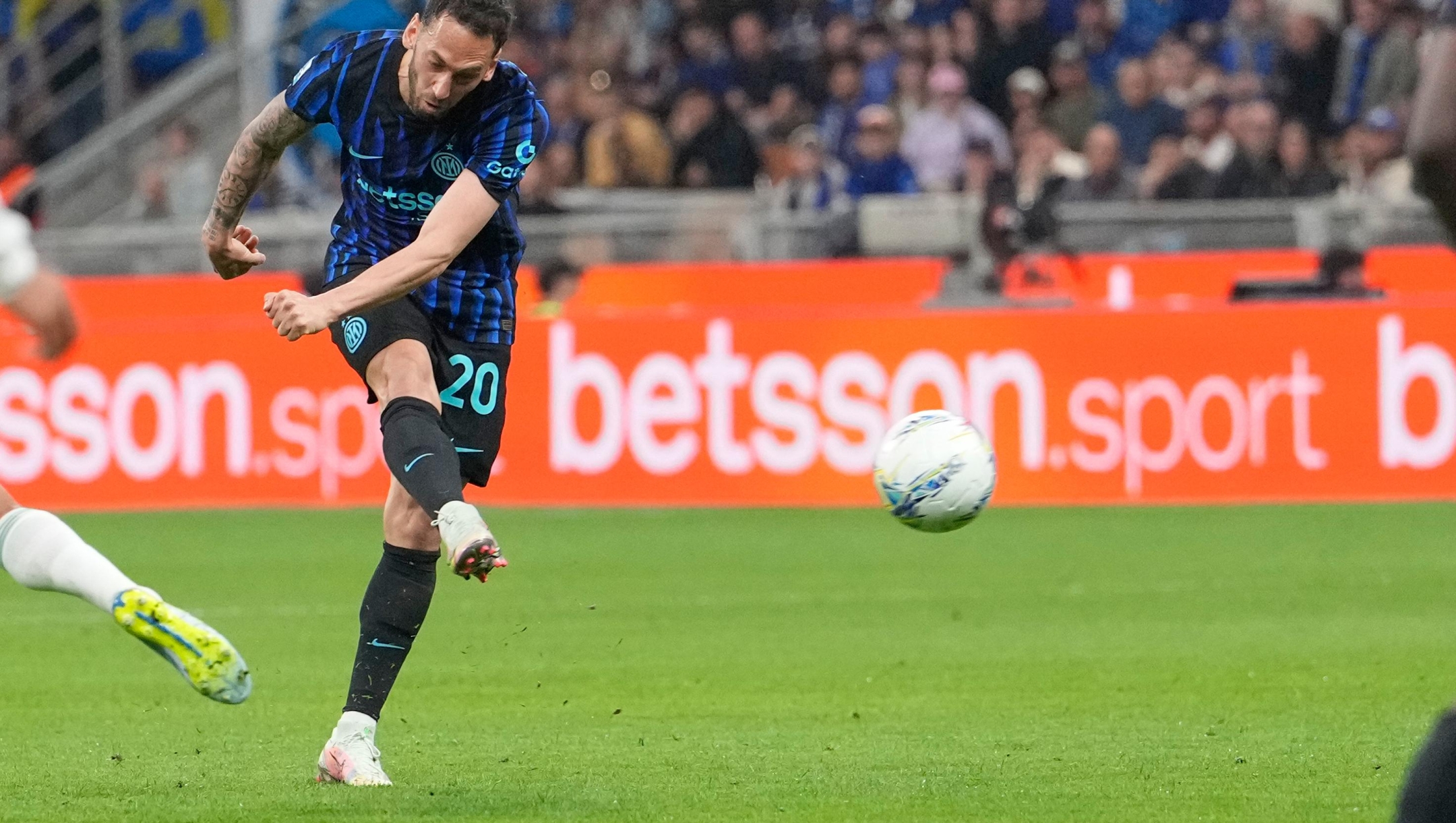 Inter Milan's Hakan Calhanoglu scores his side's second goal during the Serie A soccer match between Inter Milan and Roma in Milan, Italy, Sunday, April 5, 2026. (AP Photo/Luca Bruno)