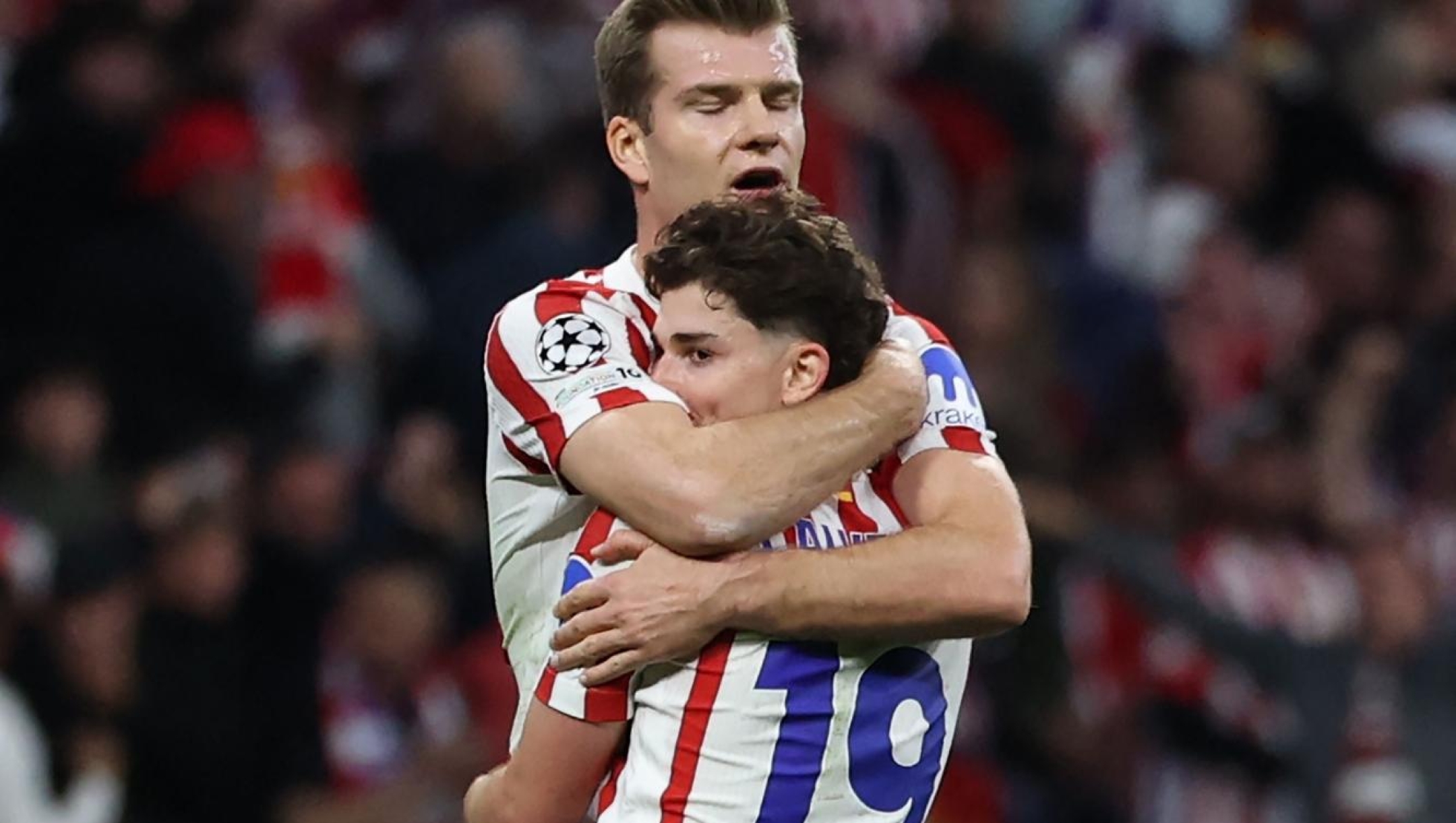 Atletico Madrid's Norwegian forward #09 Alexander Sorloth celebrates with Atletico Madrid's Argentine forward #19 Julian Alvarez at the end of the UEFA Champions League quarter final second leg football match between Club Atletico de Madrid and FC Barcelona at Metropolitano Stadium in Madrid on April 14, 2026. Atletico Madrid reaches the Champions League semi-finals. (Photo by Thomas COEX / AFP)