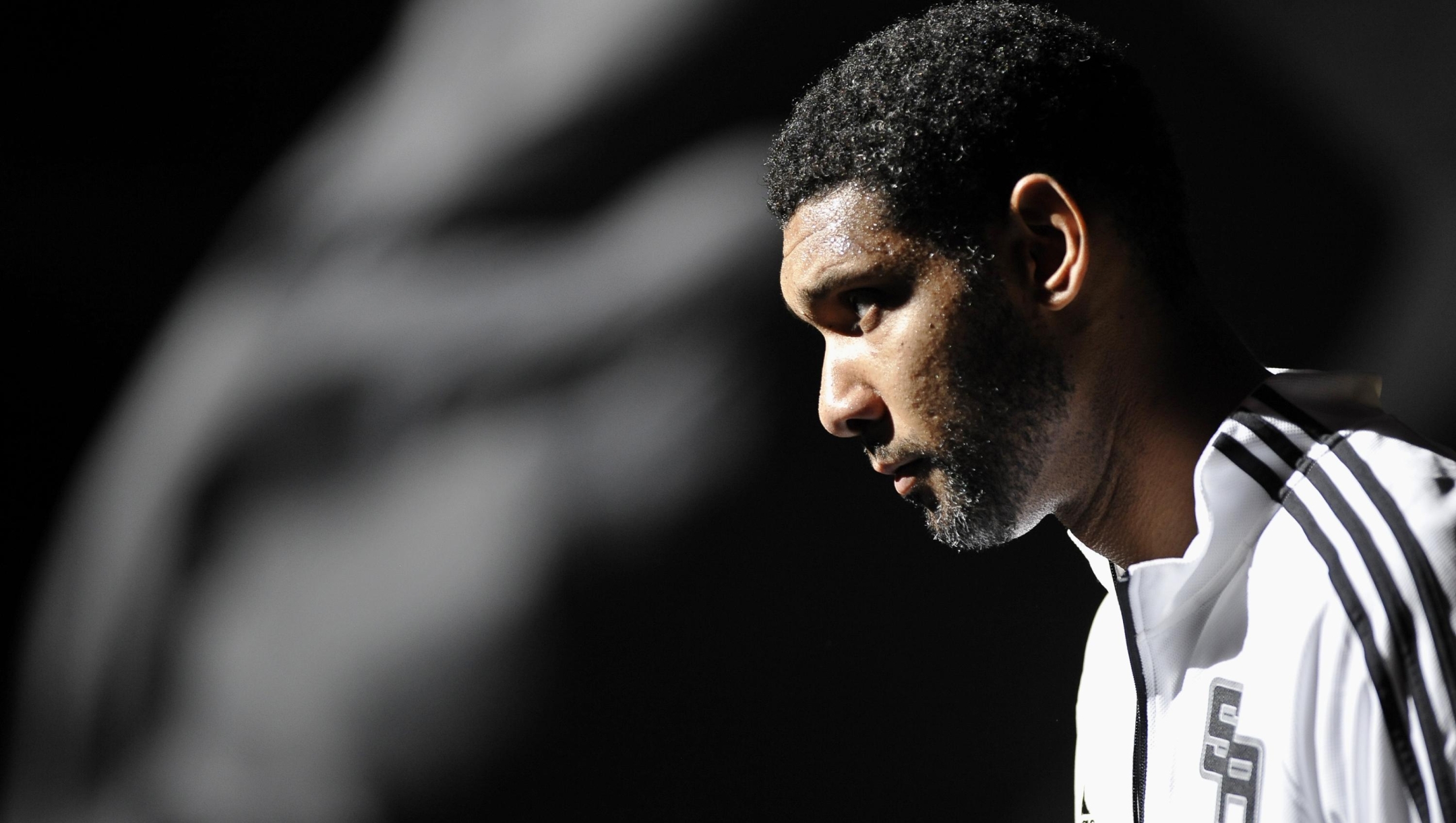 San Antonio Spurs forward Tim Duncan takes the court before a preseason NBA basketball game against the Miami Heat, Saturday, Oct. 18, 2014, in San Antonio. (AP Photo/Darren Abate)