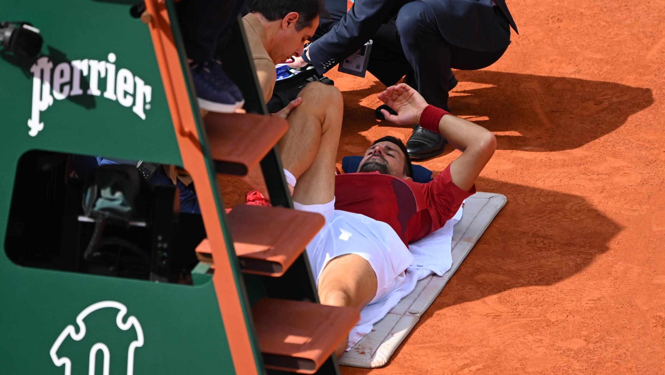  Novak Djokovic of Serbia holds his knee during his match against Francisco Cerundolo of Argentina in the Men's Singles fourth round match during Day Nine of the 2024 French Open at Roland Garros on June 03, 2024 in Paris, France. (Photo by Clive Mason/Getty Images)