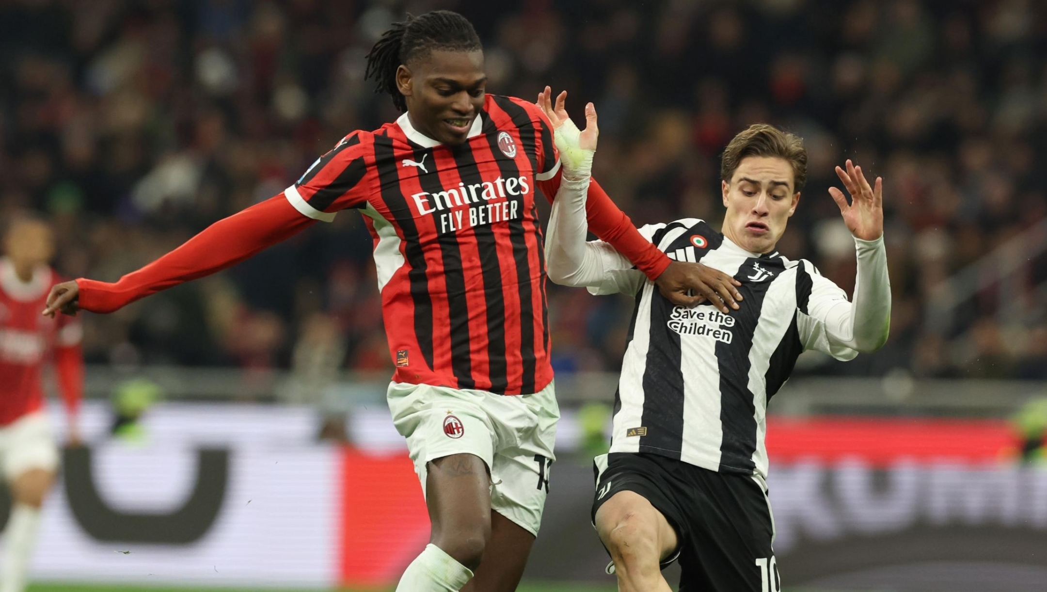  Rafael Leao of AC Milan and Kenan Yıldız of Juventus compete for the ball during the Serie match between Milan and Juventus at Stadio Giuseppe Meazza on November 23, 2024 in Milan, Italy. (Photo by Claudio Villa/AC Milan via Getty Images)