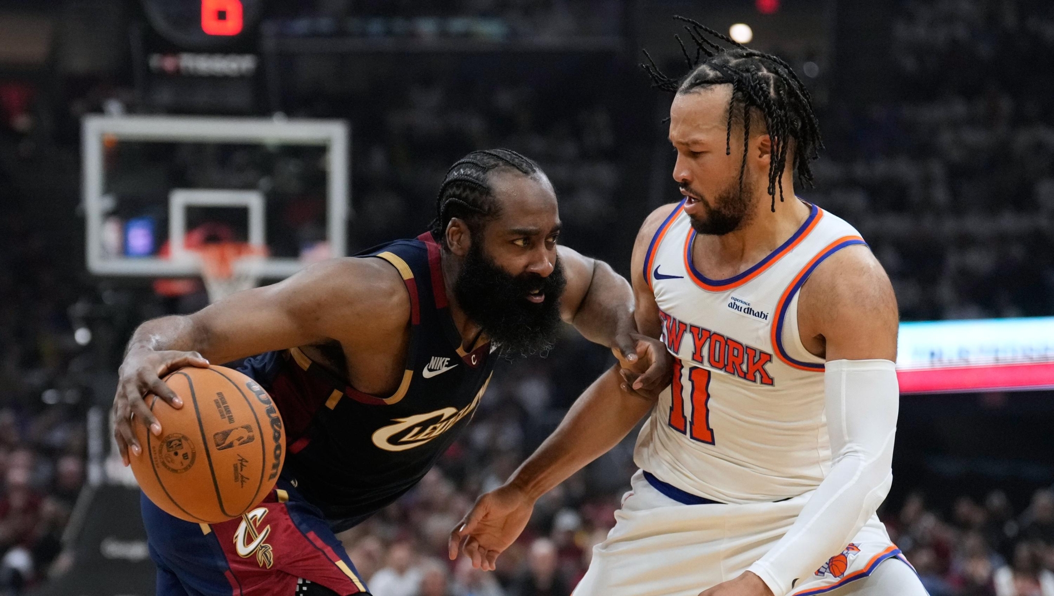 Cleveland Cavaliers guard James Harden (1) controls the ball against New York Knicks guard Jalen Brunson (11) during the second half of Game 3 in the Eastern Conference finals NBA basketball playoffs series in Cleveland, Monday, May 24, 2027. (AP Photo/Sue Ogrocki)