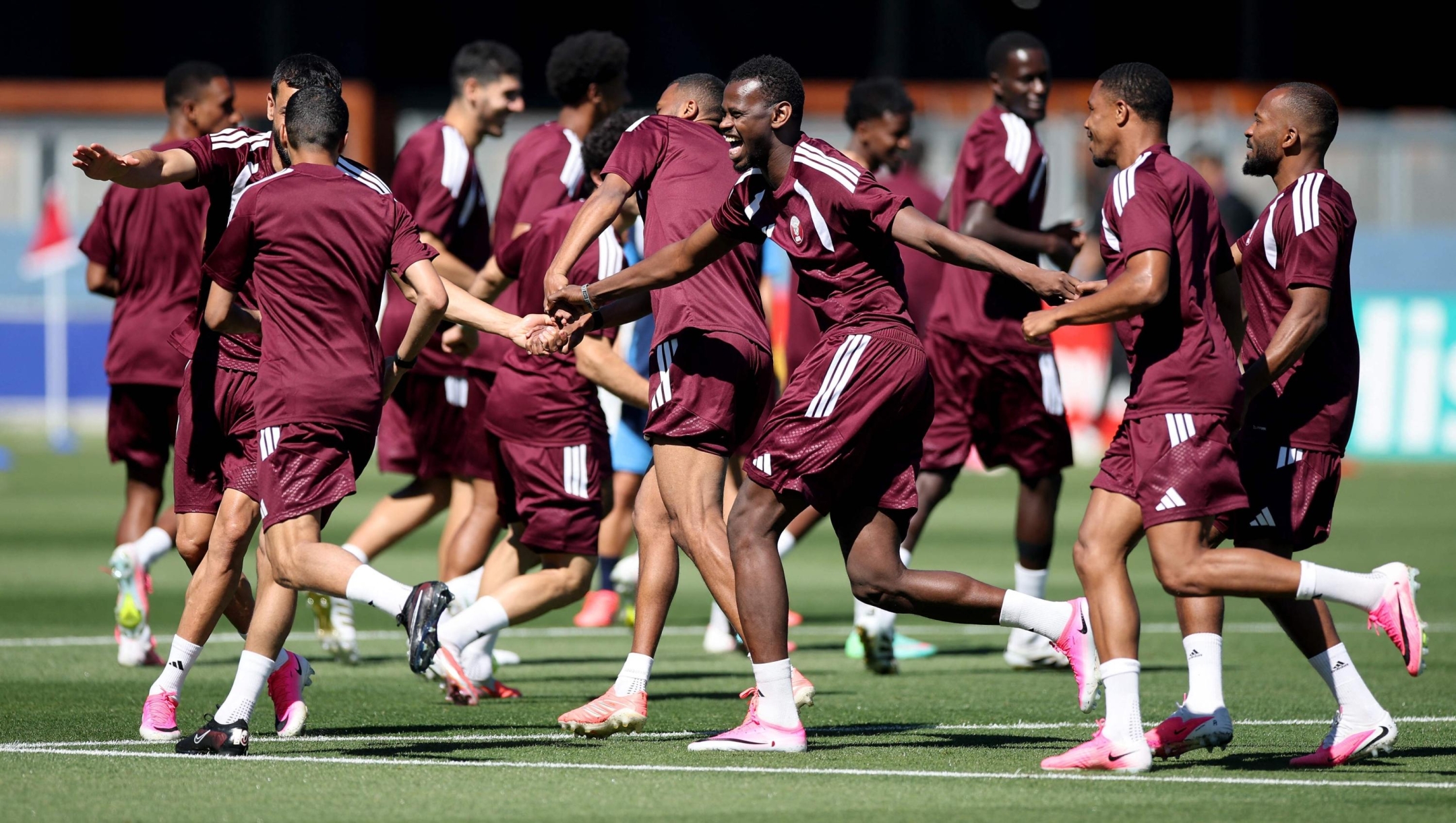  Qatar players participate in a drill during the training and press conference of Qatar one day ahead of the FIFA World Cup 2026 Group B match between Qatar and Switzerland at San Francisco Bay Area Stadium on June 12, 2026 in San Francisco, California.   Alex Grimm/Getty Images/AFP (Photo by ALEX GRIMM / GETTY IMAGES NORTH AMERICA / Getty Images via AFP)