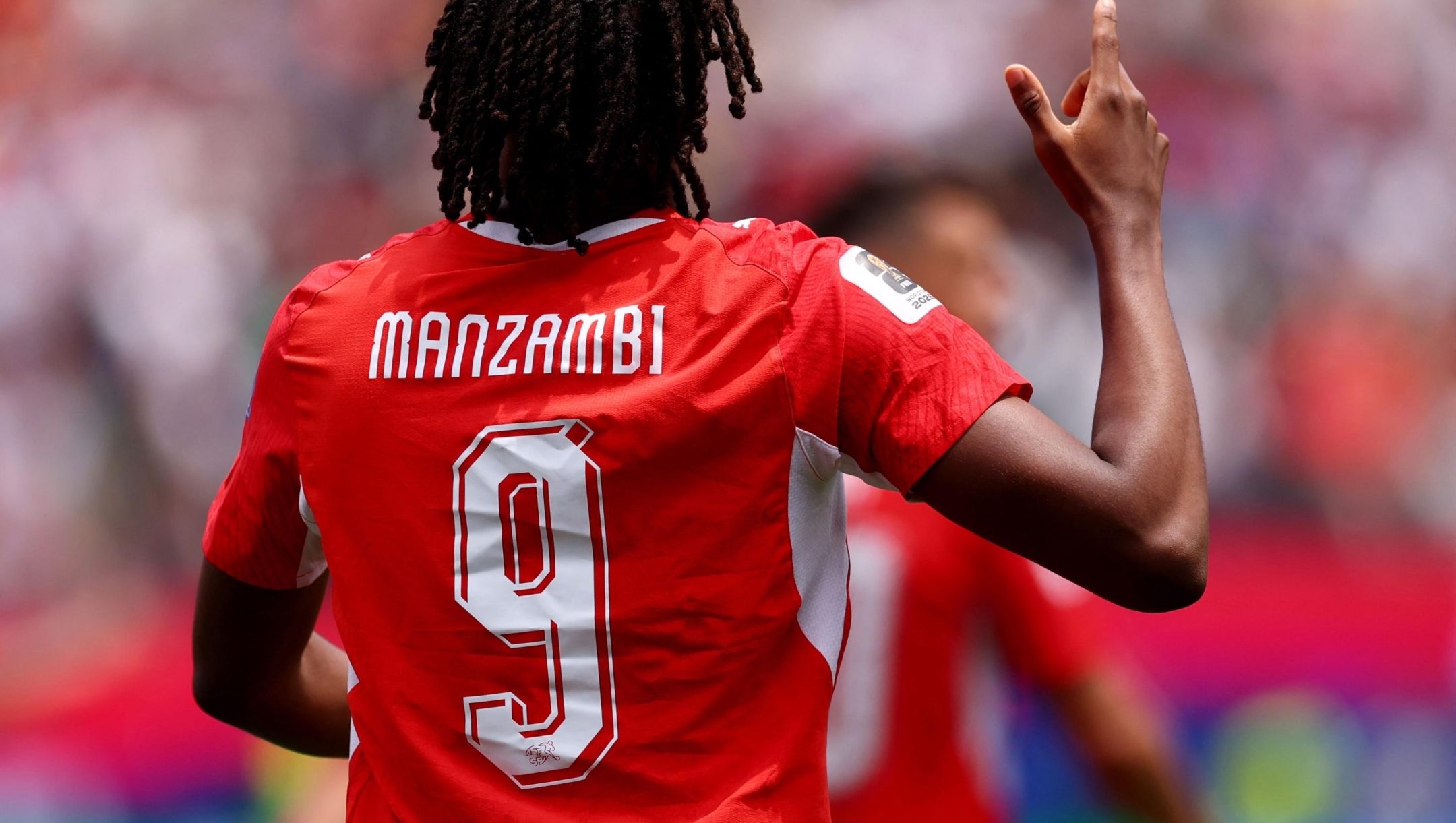  Johan Manzambi #9 of Switzerland celebrates scoring his team's first goal during the FIFA World Cup 2026 Group B match between Switzerland and Bosnia and Herzegovina at Los Angeles Stadium on June 18, 2026 in Inglewood, California.   Dean Mouhtaropoulos/Getty Images/AFP (Photo by Dean Mouhtaropoulos / GETTY IMAGES NORTH AMERICA / Getty Images via AFP)