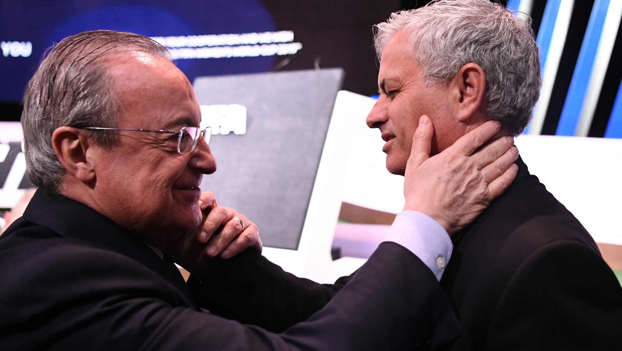 Real Madrid's president Florentino Perez (L) embraces Portuguese football manager Jose Mourinho at the 69th FIFA Congress at Paris Expo, Porte de Versailles in Paris on June 5, 2019. Gianni Infantino was re-elected by acclamation for a second term as FIFA president on June 5, 2019. The 49 year-old, who took charge of FIFA in February 2016 after the departure of the disgraced Sepp Blatter, stood unopposed for re-election for a new four-year term which will run until 2023. (Photo by FRANCK FIFE / AFP)