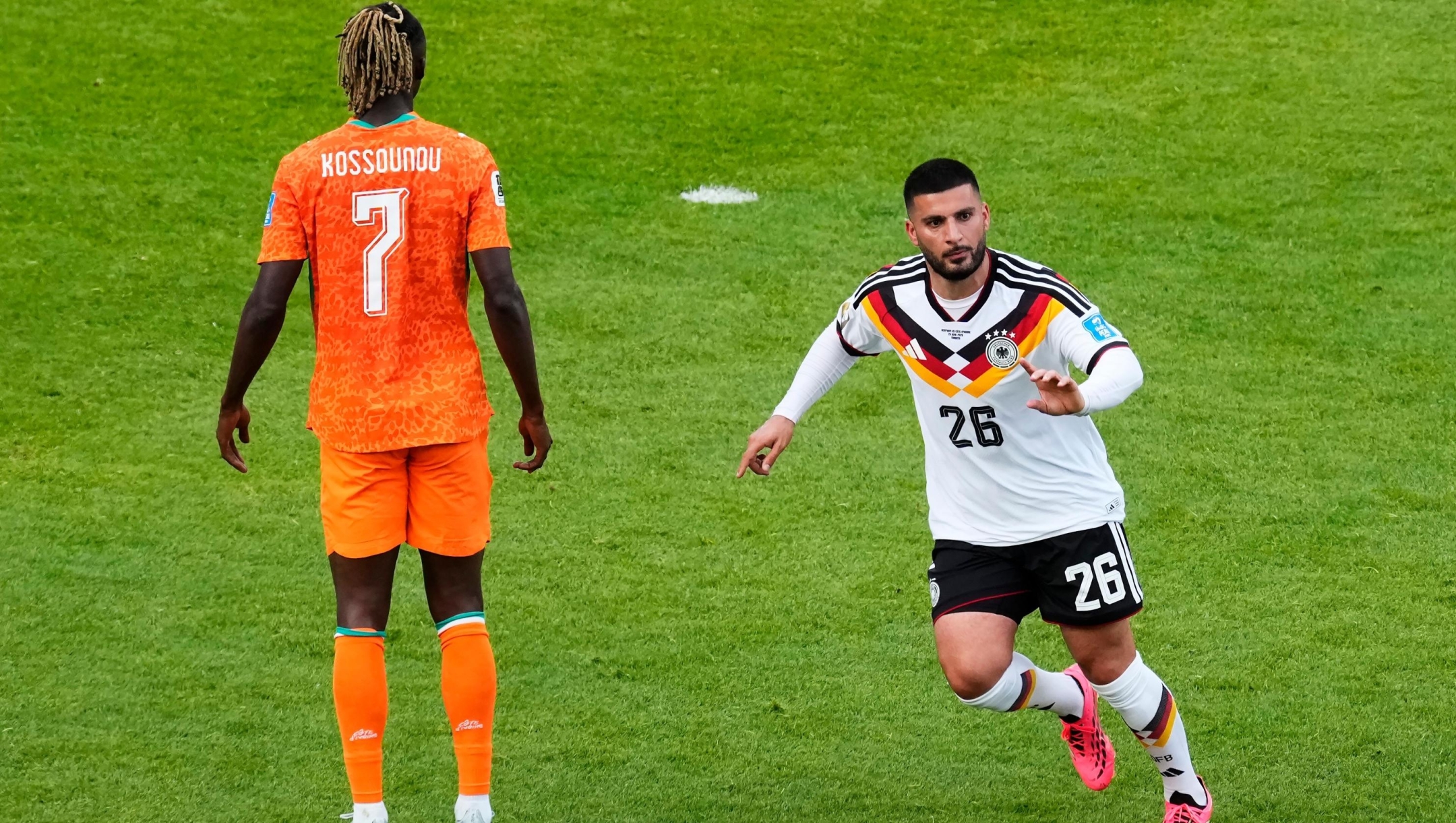 Germany's Deniz Undav (26) celebrates his scoring his team's second goal as Ivory Coast's Odilon Kossounou (7) looks away during the World Cup Group E soccer match between Germany and Ivory Coast in Toronto, Saturday, June 20, 2026. (Chris Young/The Canadian Press via AP)