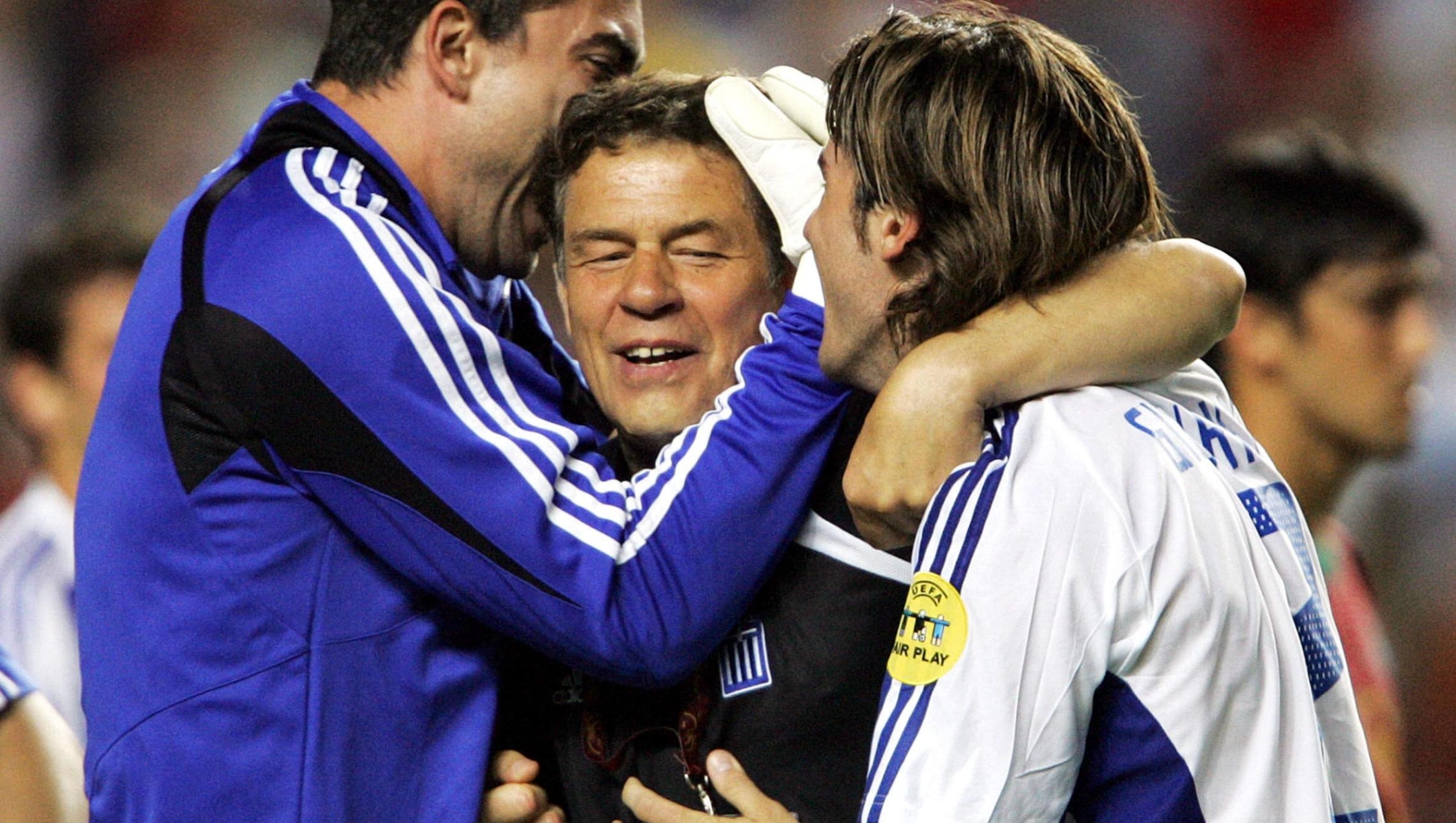 Greece's coach Otto Rehhagel (C) celebrates with defender Georgios Seitaridis (L) and Chalkias Konstantinos, 04 July 2004 at the Luz stadium in Lisbon after winning the Euro 2004 final match between Portugal and Greece at the European Nations football championship in Portugal. Greece won 1-0 to be crowned European Champions.
AFP PHOTO Francois GUILLOT (Photo by FRANCOIS GUILLOT / AFP)