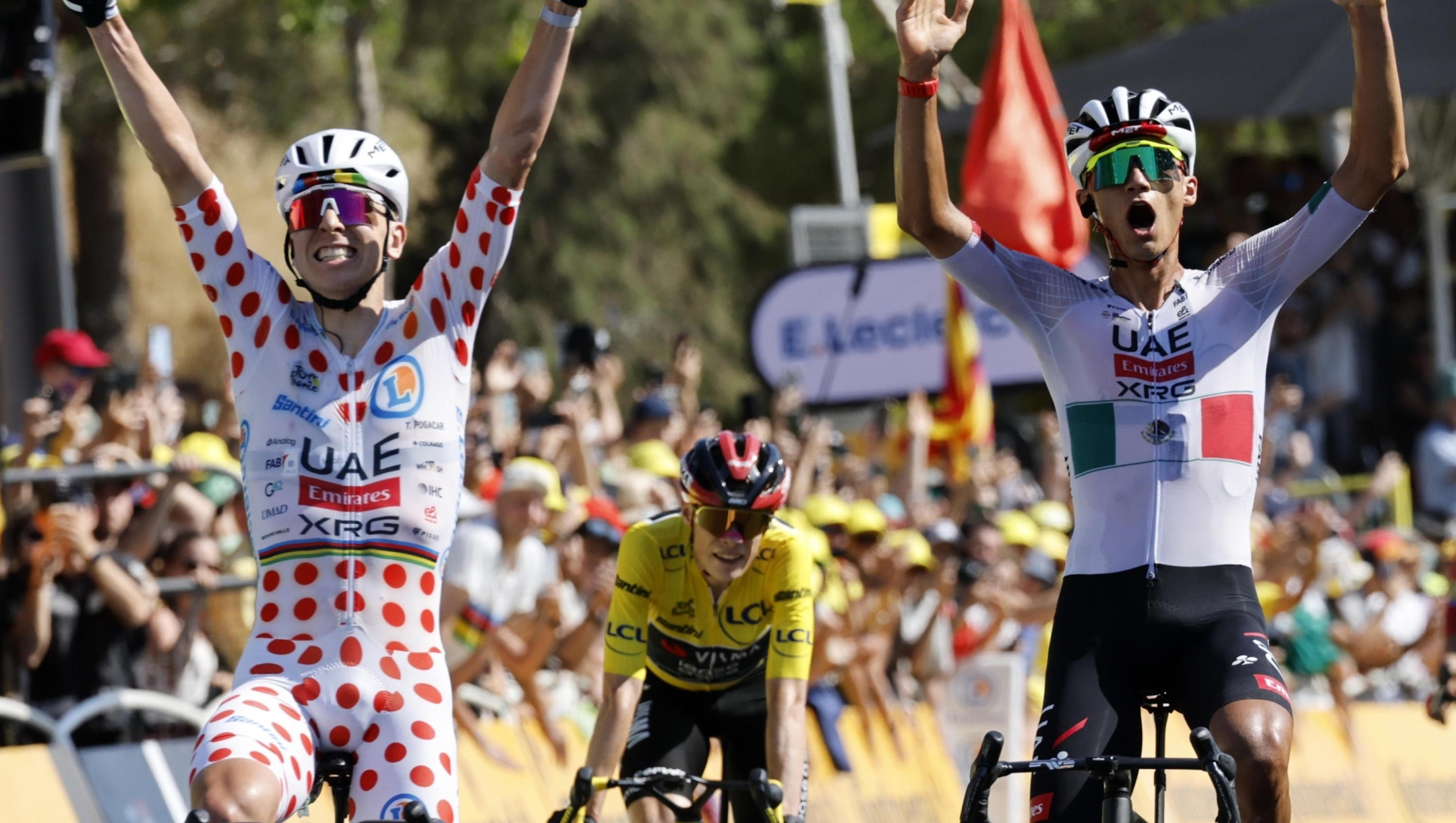 epaselect epa13089257 Yellow Jersey overall leader Danish cyclist Jonas Vingegaard (C) of Team Visma | Lease a Bike looks on as Mexican cyclist Isaac del Toro (R) of UAE Team Emirates XRG celebrates at the finish line with teammate Polka Dot Jersey best climber Slovenian cyclist Tadej Pogacar (L) after Del Toro wins the 2nd stage of the Tour de France cycling tour, a 168.5 km race from Tarragone to Barcelona, Spain, 05 July 2026.  EPA/YOAN VALAT