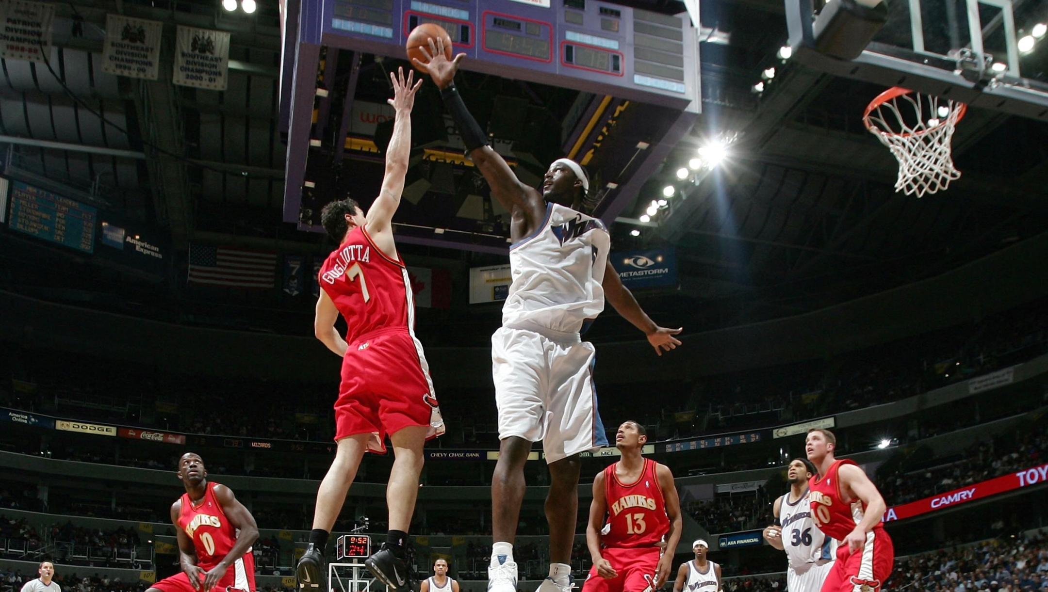   Kwame Brown #5 of the Washington Wizards and Tom Gugliotta #7 of the Atlanta Hawks vie for a rebound on March 30, 2005 at the MCI Center in Washington, DC. The Wizards defeated the Hawks 102-99.  NOTE TO USER: User expressly acknowledges and agrees that, by downloading and/or using this Photograph, user is consenting to the terms and conditions of the Getty Images License Agreement.  (Photo by Doug Pensinger/Getty Images) *** Local Caption *** Kwame Brown;Tom Gugliotta (Photo by Doug Pensinger / Getty Images North America / Getty Images via AFP)