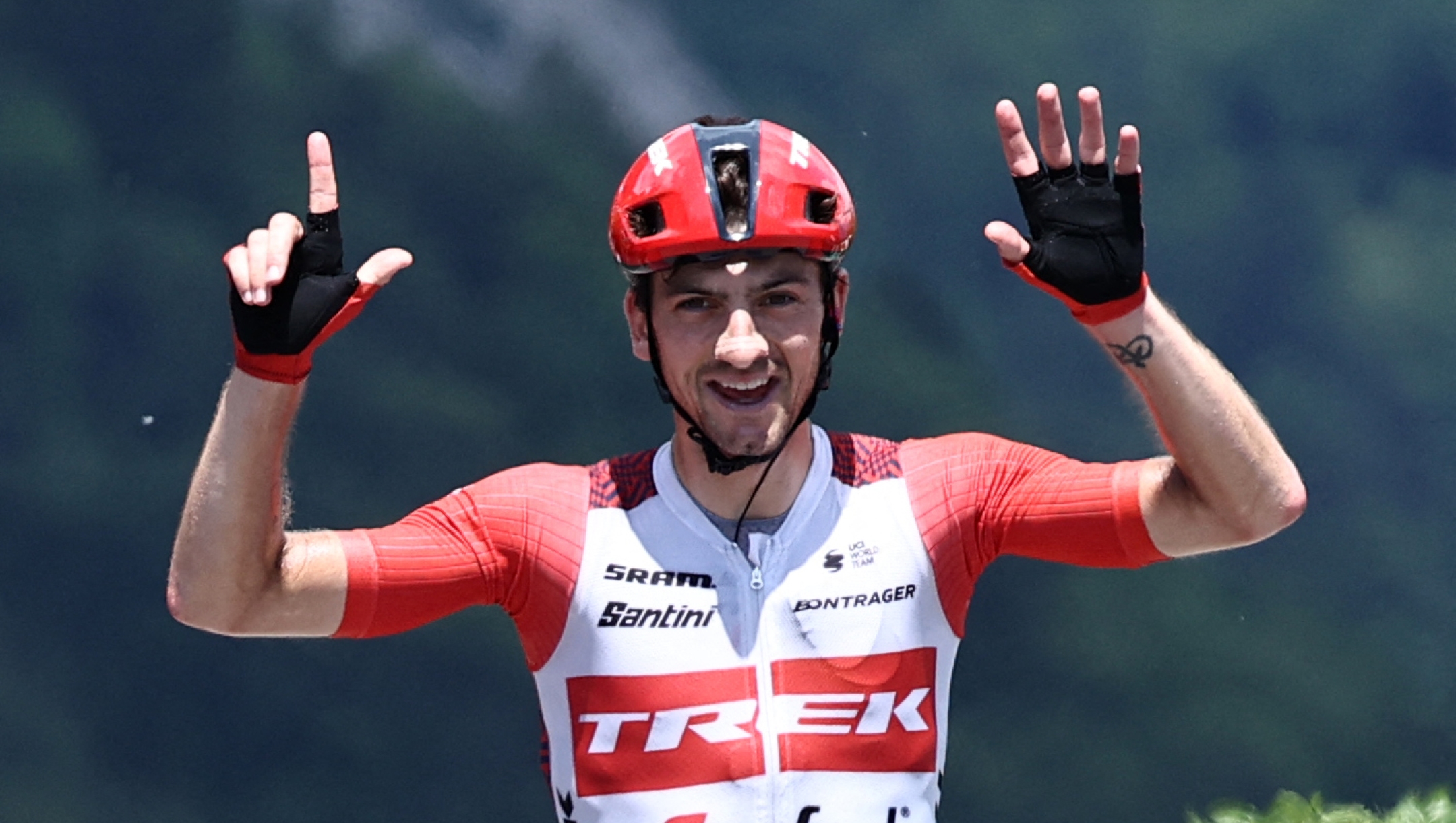 TOPSHOT - Trek - Segafredo's Italian rider Giulio Ciccone celebrates as he crosses the finish line to win the eighth stage of the 75th edition of the Criterium du Dauphine cycling race, 153km between Le Pont-de-Claix city to La Bastille in Grenoble, France, on June 11, 2023. (Photo by Anne-Christine POUJOULAT / AFP)