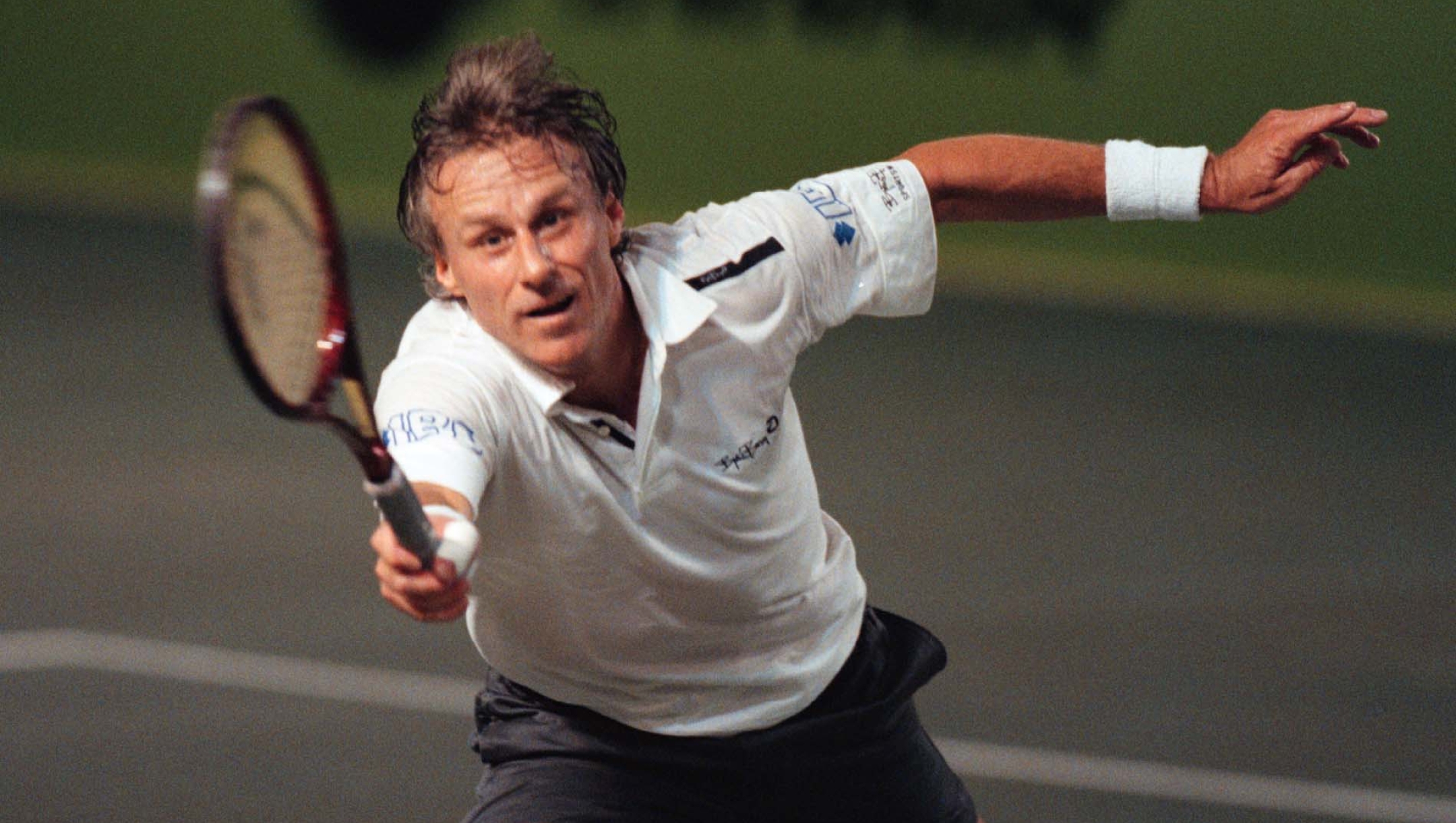 Bjorn Borg strikes a forehand against Mats Wilander during the round-robuin-tournament between them and the third former Swedish tennis great, Stefan Edberg, in Stockholm, Sweden Thursday January 13 2000.  The tournament marked Borg«s farewell to Swedish fans. Wilander won this match by 4-2, 2-4, 4-1.(AP photo/Jonas Ekstromer/Pressens Bild)