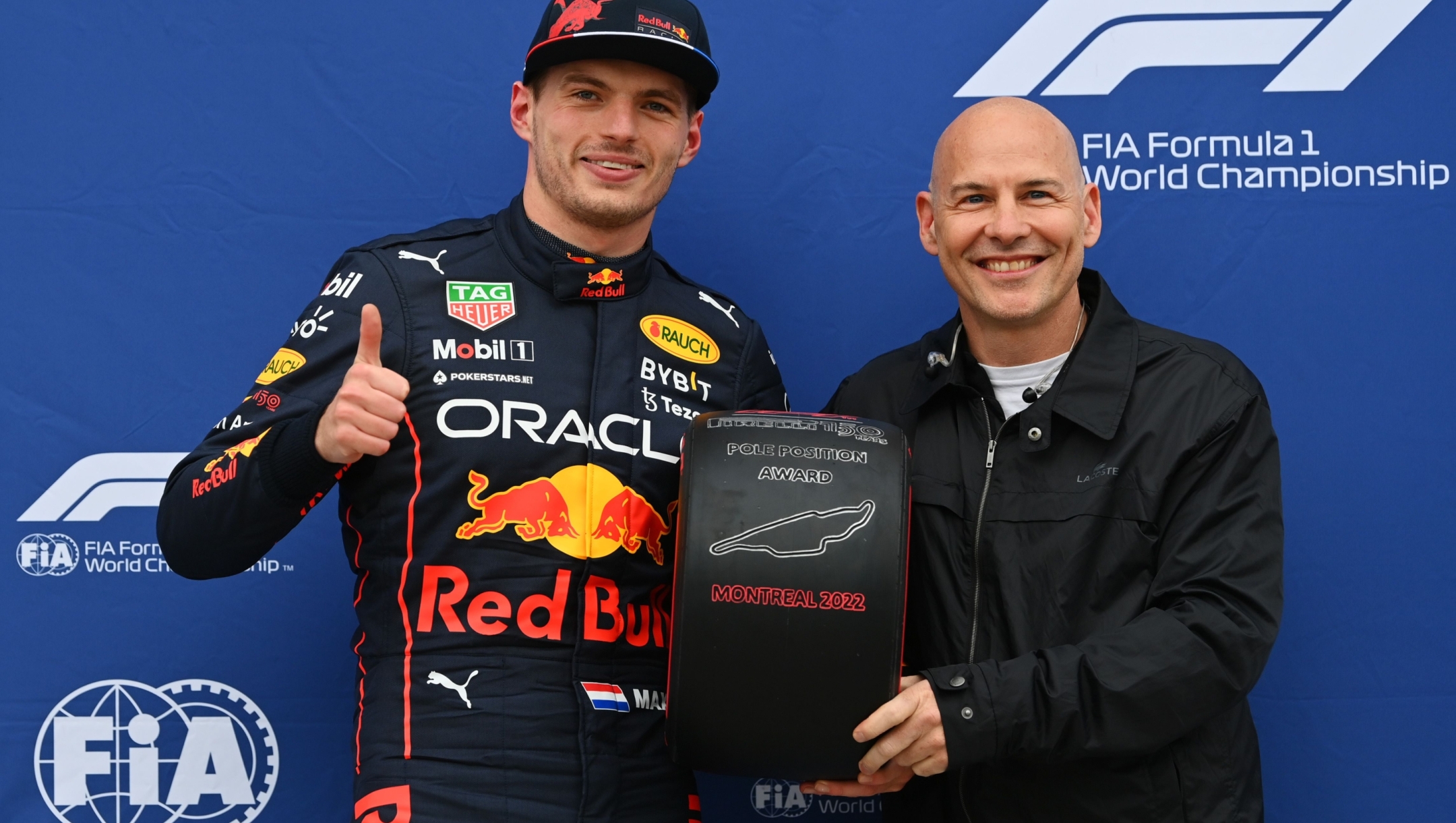 MONTREAL, QUEBEC - JUNE 18: Pole position qualifier Max Verstappen of the Netherlands and Oracle Red Bull Racing is presented with the Pirelli Pole Position Award by Jacques Villeneuve during qualifying ahead of the F1 Grand Prix of Canada at Circuit Gilles Villeneuve on June 18, 2022 in Montreal, Quebec.   Dan Mullan/Getty Images/AFP
== FOR NEWSPAPERS, INTERNET, TELCOS & TELEVISION USE ONLY ==