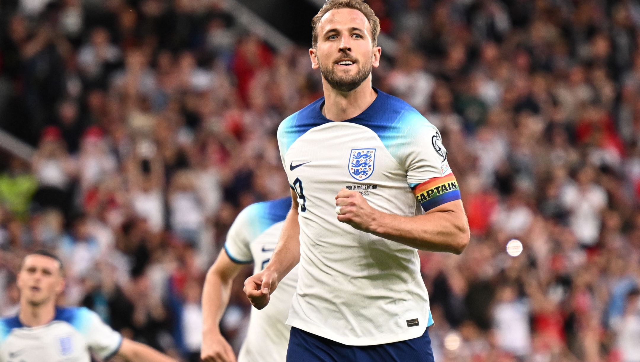 England's striker Harry Kane celebrates after scoring their seventh goal from the penalty spot during the UEFA Euro 2024 group C qualification football match between England and North Macedonia at Old Trafford in Manchester, north west England, on June 19, 2023. (Photo by Oli SCARFF / AFP) / NOT FOR MARKETING OR ADVERTISING USE / RESTRICTED TO EDITORIAL USE