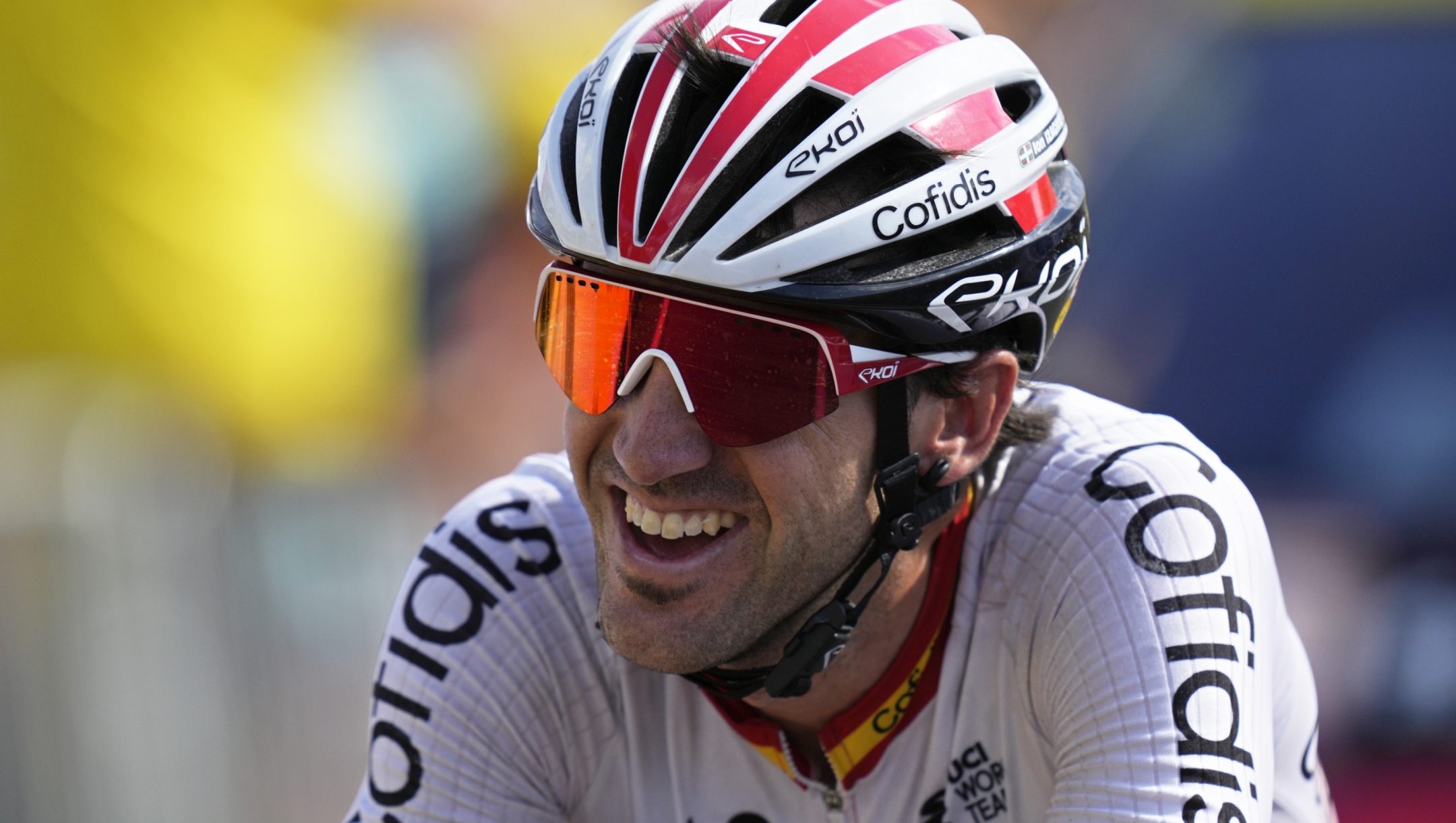 Spain's Ion Izagirre smiles as he crosses the finish line to win the twelfth stage of the Tour de France cycling race over 169 kilometers (105 miles) with start in Roanne and finish in Belleville-en-Beaujolais, France, Thursday, July 13, 2023. (AP Photo/Daniel Cole)