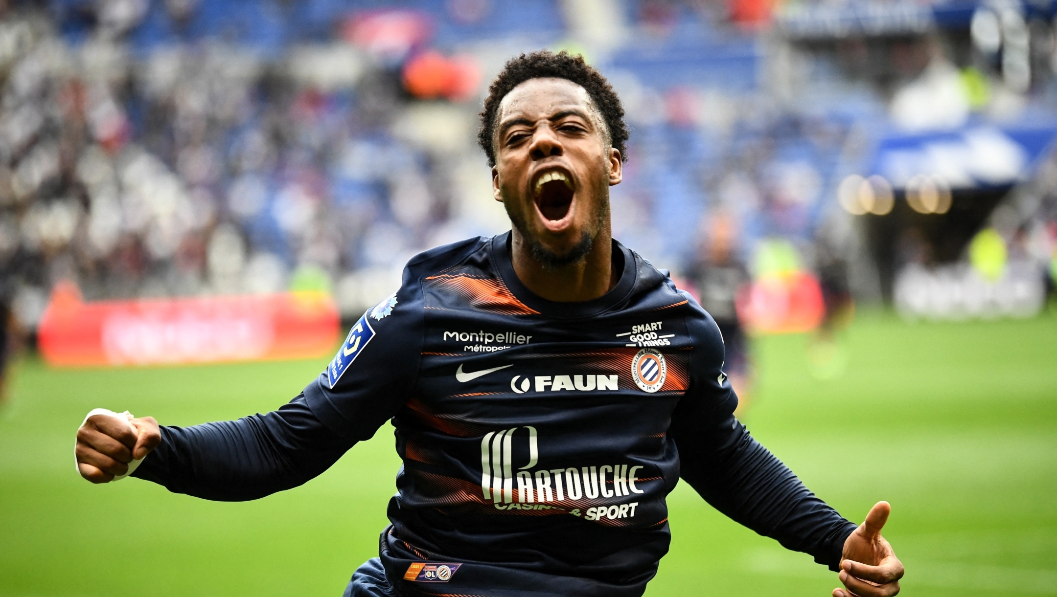 Montpellier's French forward Elye Wahi celebrates scoring his team's first goal during the French L1 football match between Olympique Lyonnais (OL) and Montpellier Herault SC at The Groupama Stadium in Decines-Charpieu, central-eastern France on May 7, 2023. (Photo by OLIVIER CHASSIGNOLE / AFP)